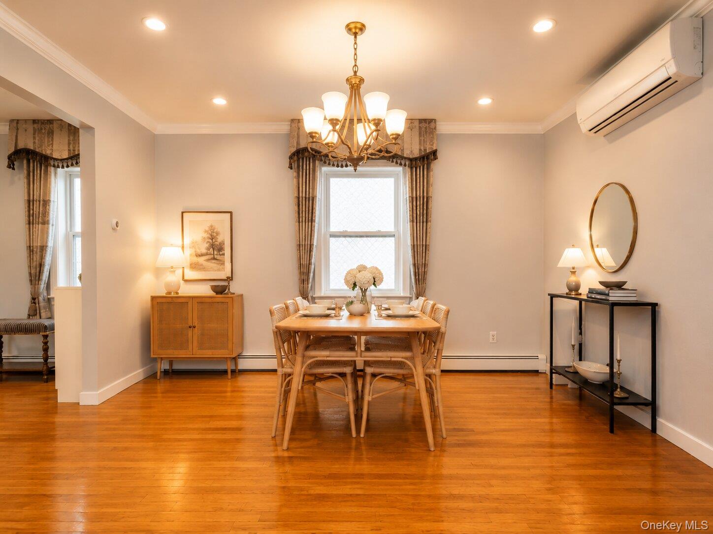 45-32 Westminster Road Great Neck, NY 11020 - Photo 8 of 21 a view of a dining room with furniture window and wooden floor