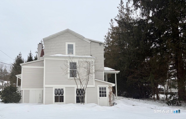 41 Maple Avenue Norfolk, CT 06058 - Photo 6 of 8 a front view of a house with a yard