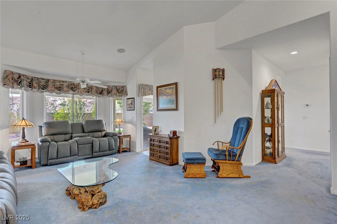 770 Fairway Drive Boulder City, NV 89005 - Photo 8 of 61 Carpeted living area with a ceiling fan and lofted ceiling