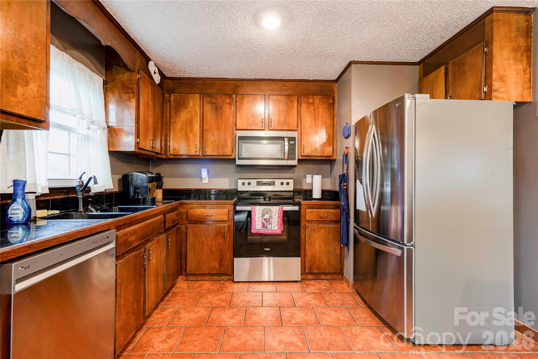 111 Hicks Road Grover, NC 28073 - Photo 11 of 35 a kitchen with stainless steel appliances granite countertop a refrigerator stove and sink