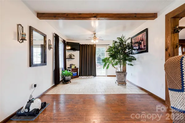 a view of a living room and entryway