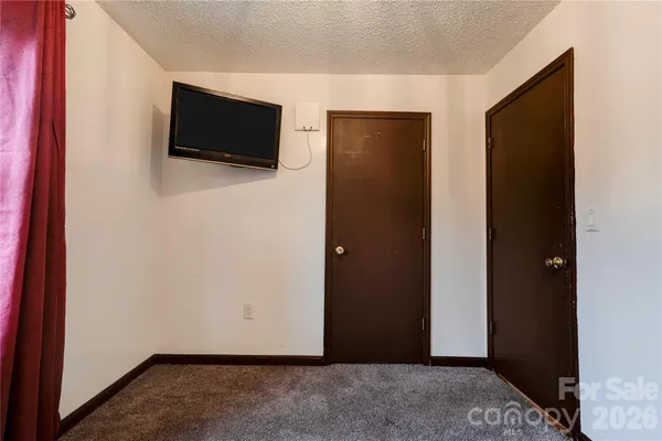 a view of a livingroom with a flat screen tv