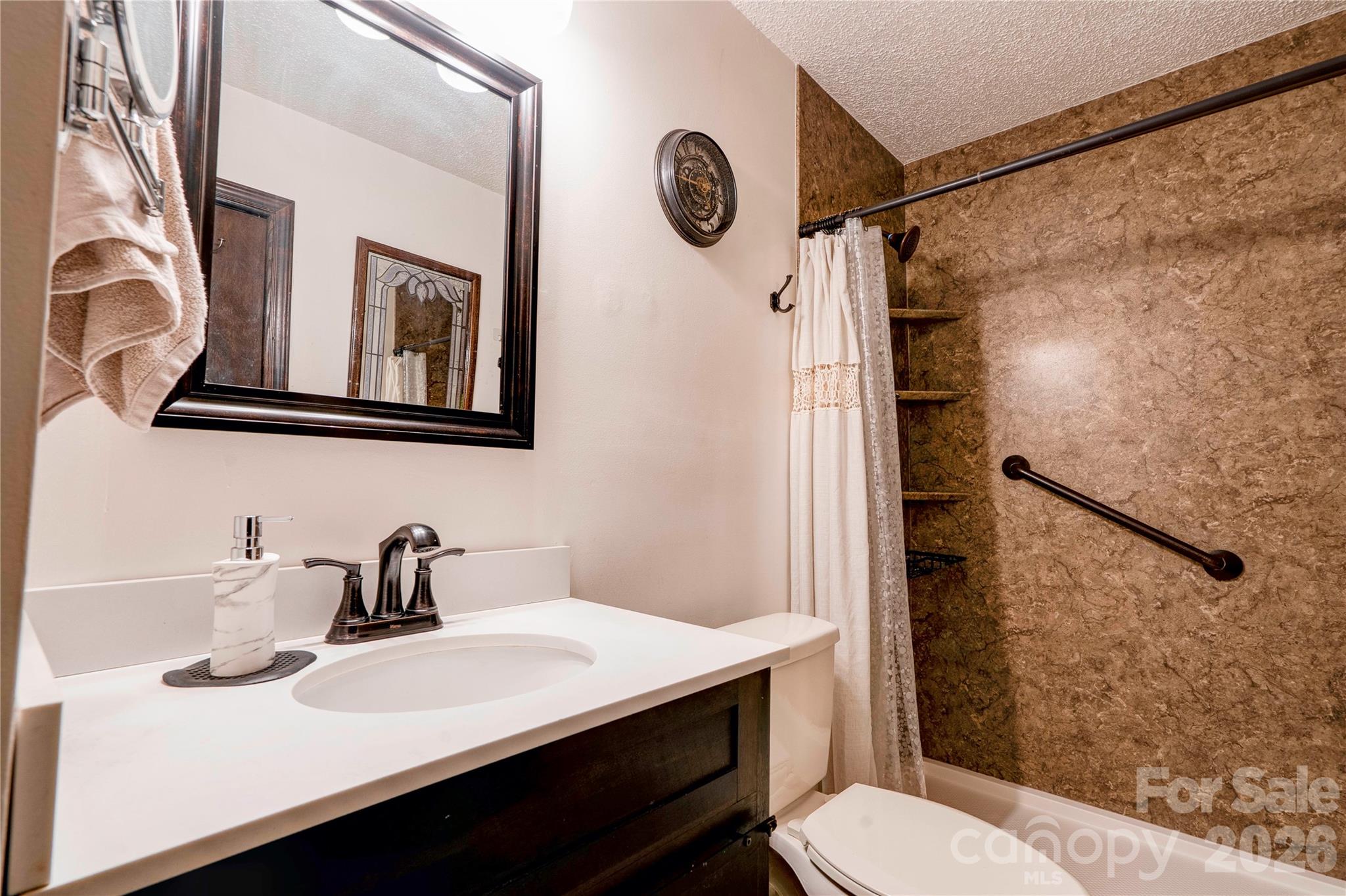 111 Hicks Road Grover, NC 28073 - Photo 20 of 35 a bathroom with a sink a toilet and shower