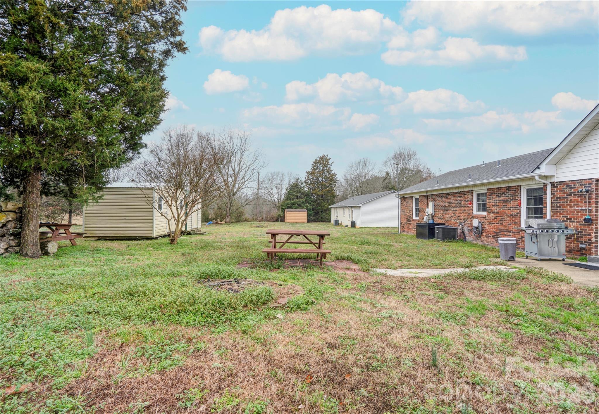 111 Hicks Road Grover, NC 28073 - Photo 34 of 35 a view of a house with backyard and sitting area