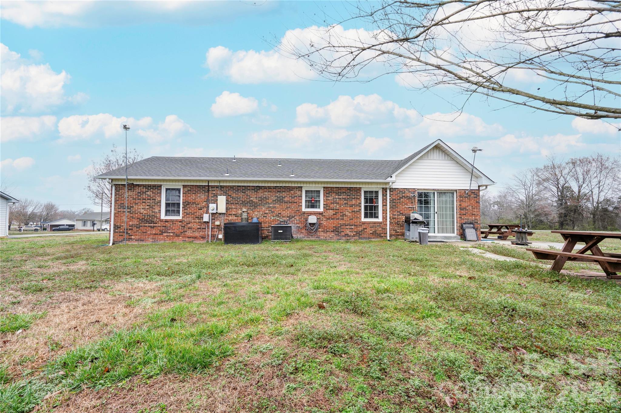 111 Hicks Road Grover, NC 28073 - Photo 35 of 35 a view of a house with a yard and sitting area