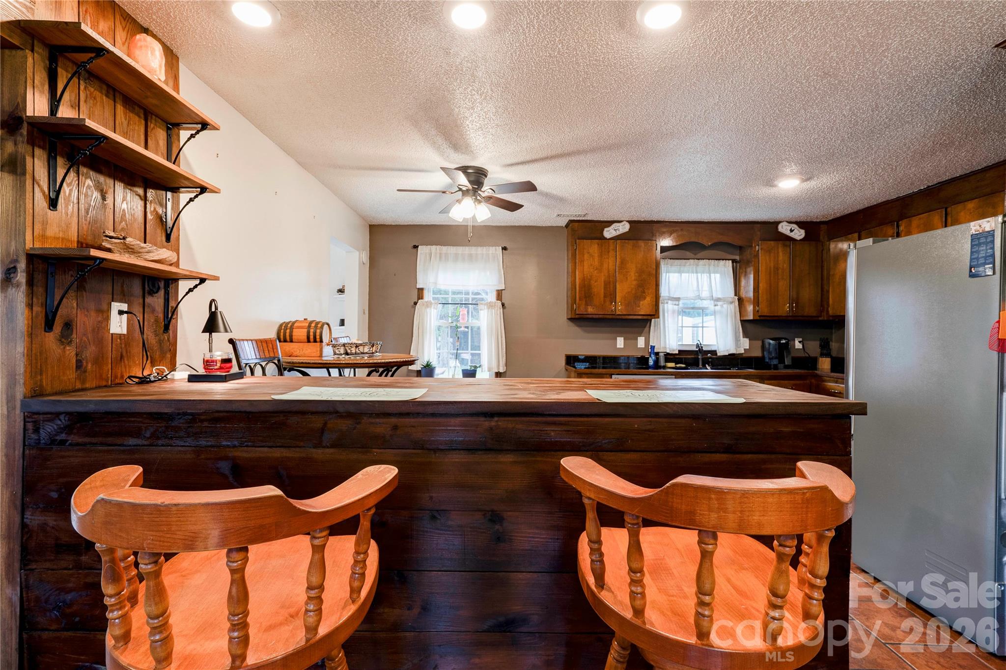 111 Hicks Road Grover, NC 28073 - Photo 9 of 35 a kitchen with stainless steel appliances granite countertop a chairs a sink and a stove