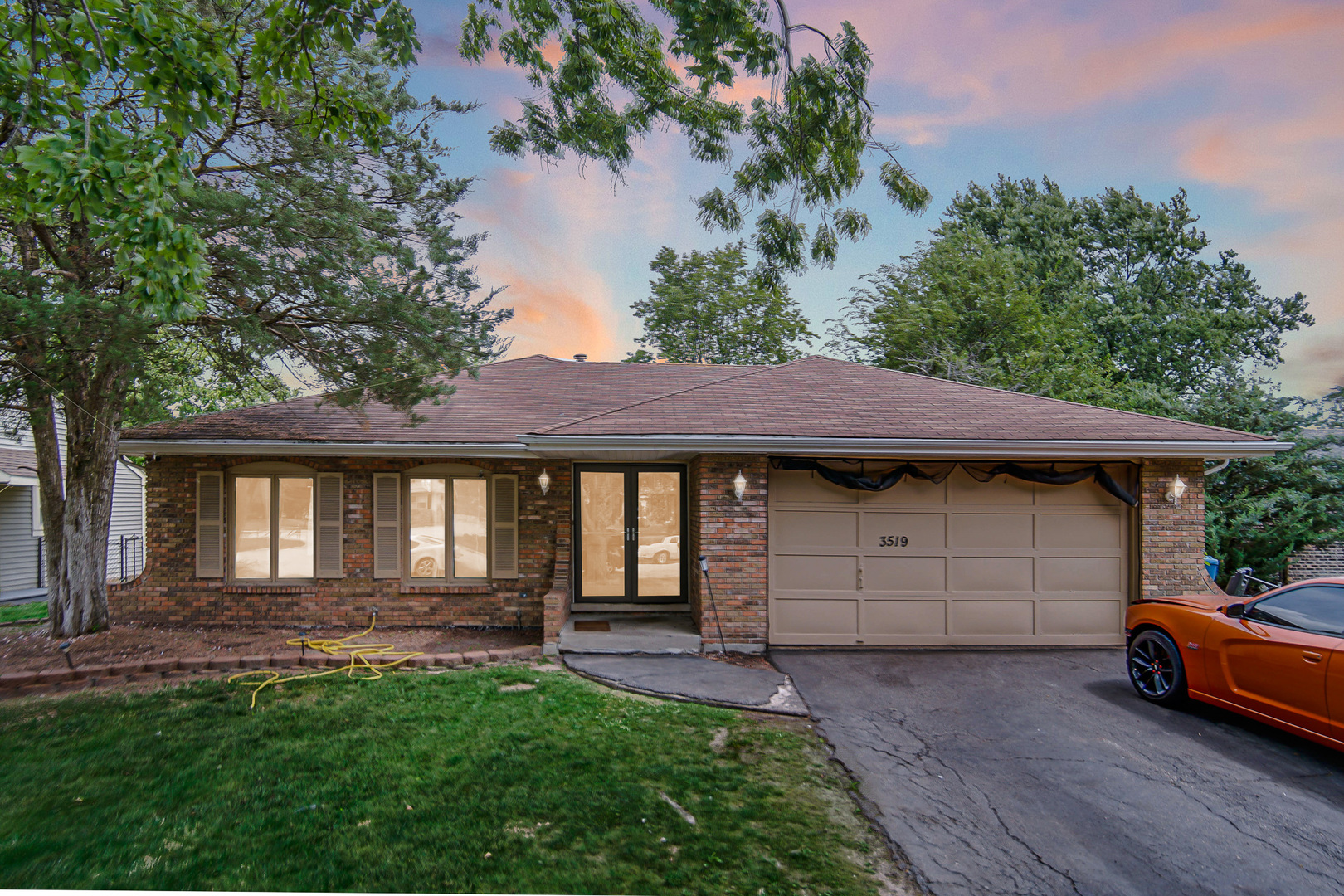 a front view of a house with a garden