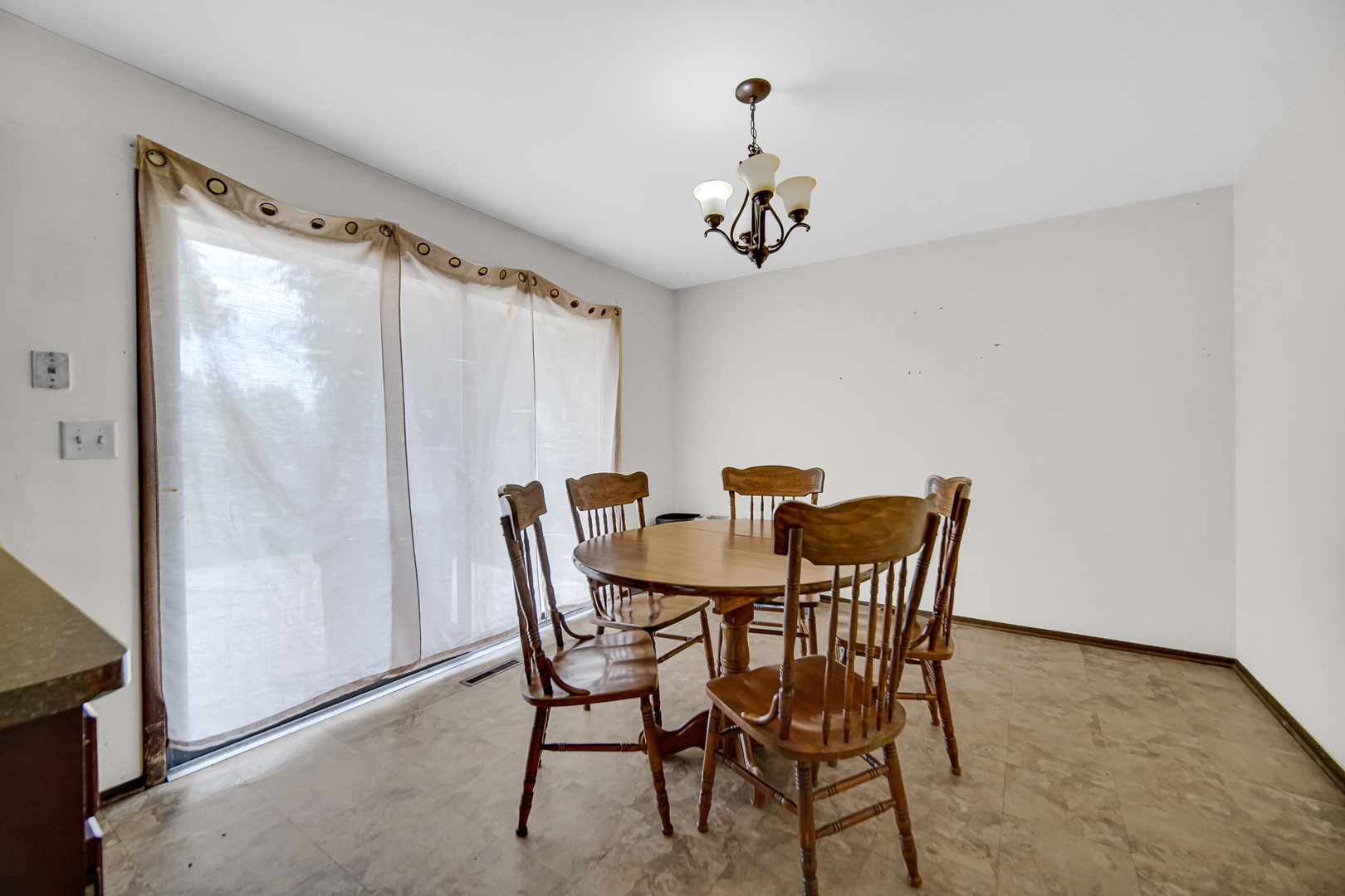 3519 Arthur Road Crete, IL 60417 - Photo 3 of 17 a view of a dining room with furniture and chandelier