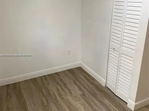 a view of wooden floor in an empty room