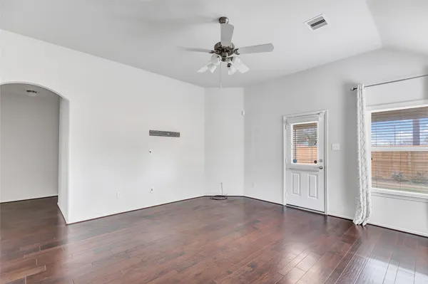 a view of kitchen with wooden floor electronic appliances and window