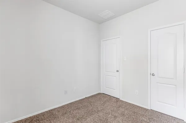 a view of a livingroom with a chandelier fan