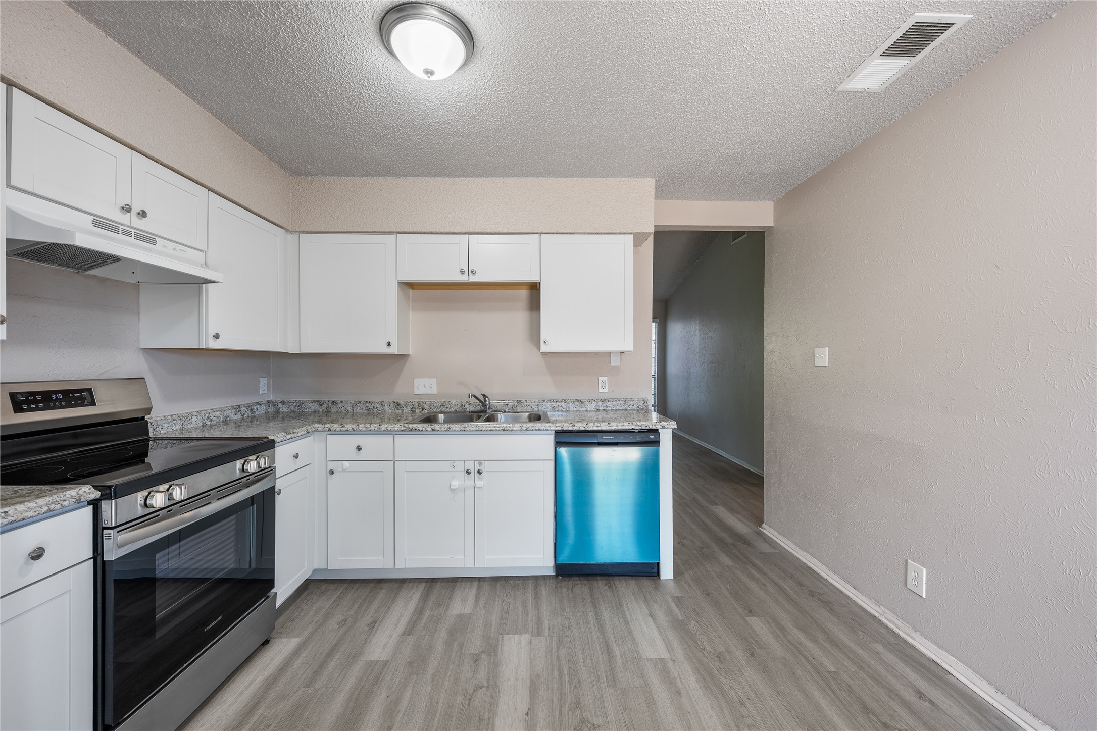 1111 West Rundberg Lane Austin, TX 78758 - Photo 2 of 16 A well-appointed kitchen boasts sleek stainless steel appliances and abundant white cabinetry.
