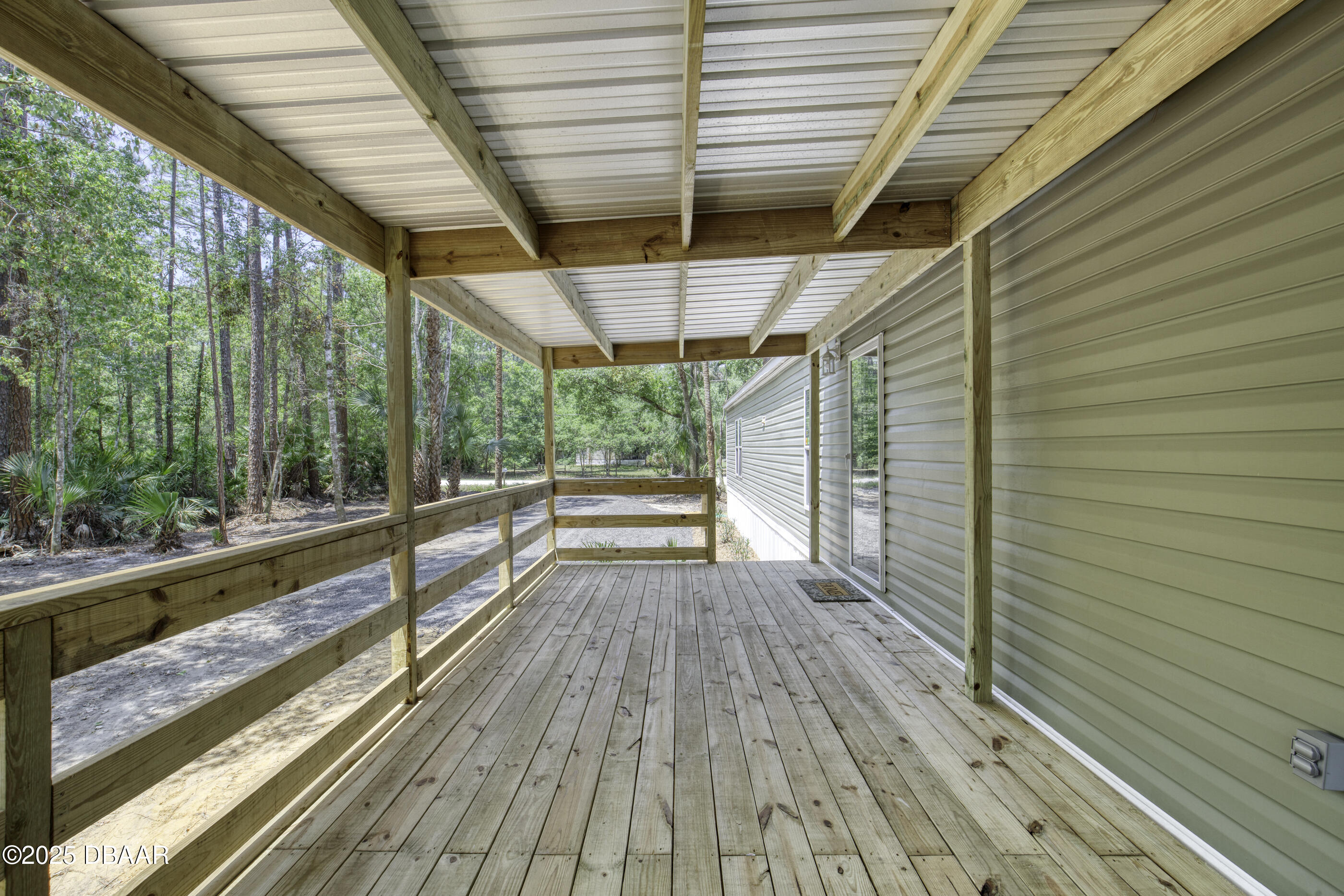 2089 Guava Lane Bunnell, FL 32110 - Photo 11 of 58 a view of porch with wooden floor