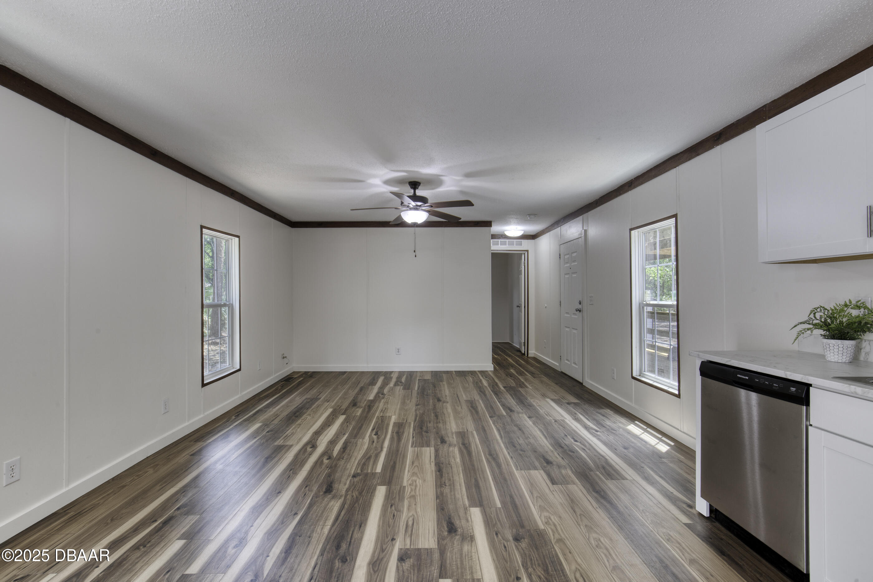 2089 Guava Lane Bunnell, FL 32110 - Photo 14 of 58 wooden floor in an empty room with a window