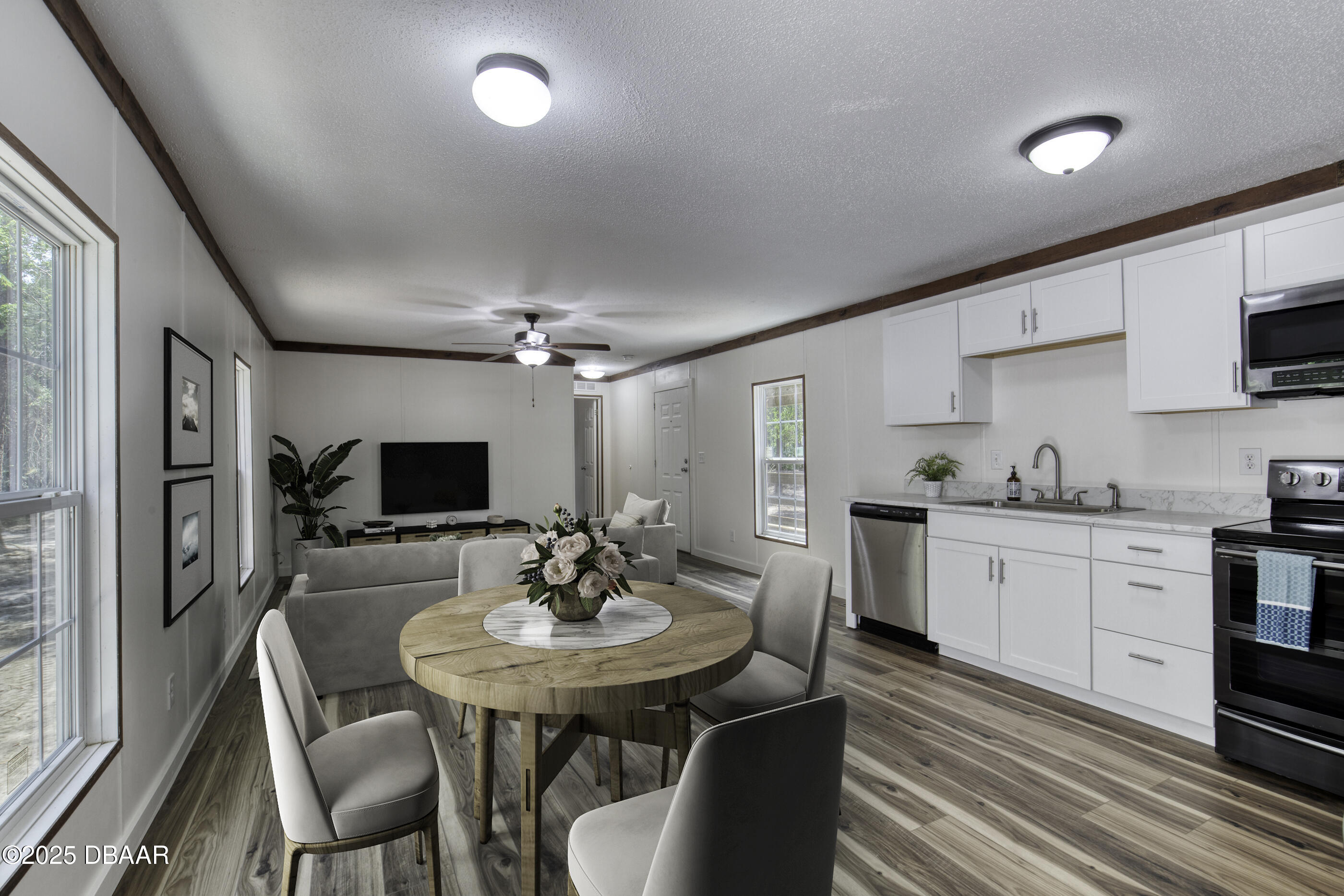 2089 Guava Lane Bunnell, FL 32110 - Photo 20 of 58 a kitchen with sink table and chairs