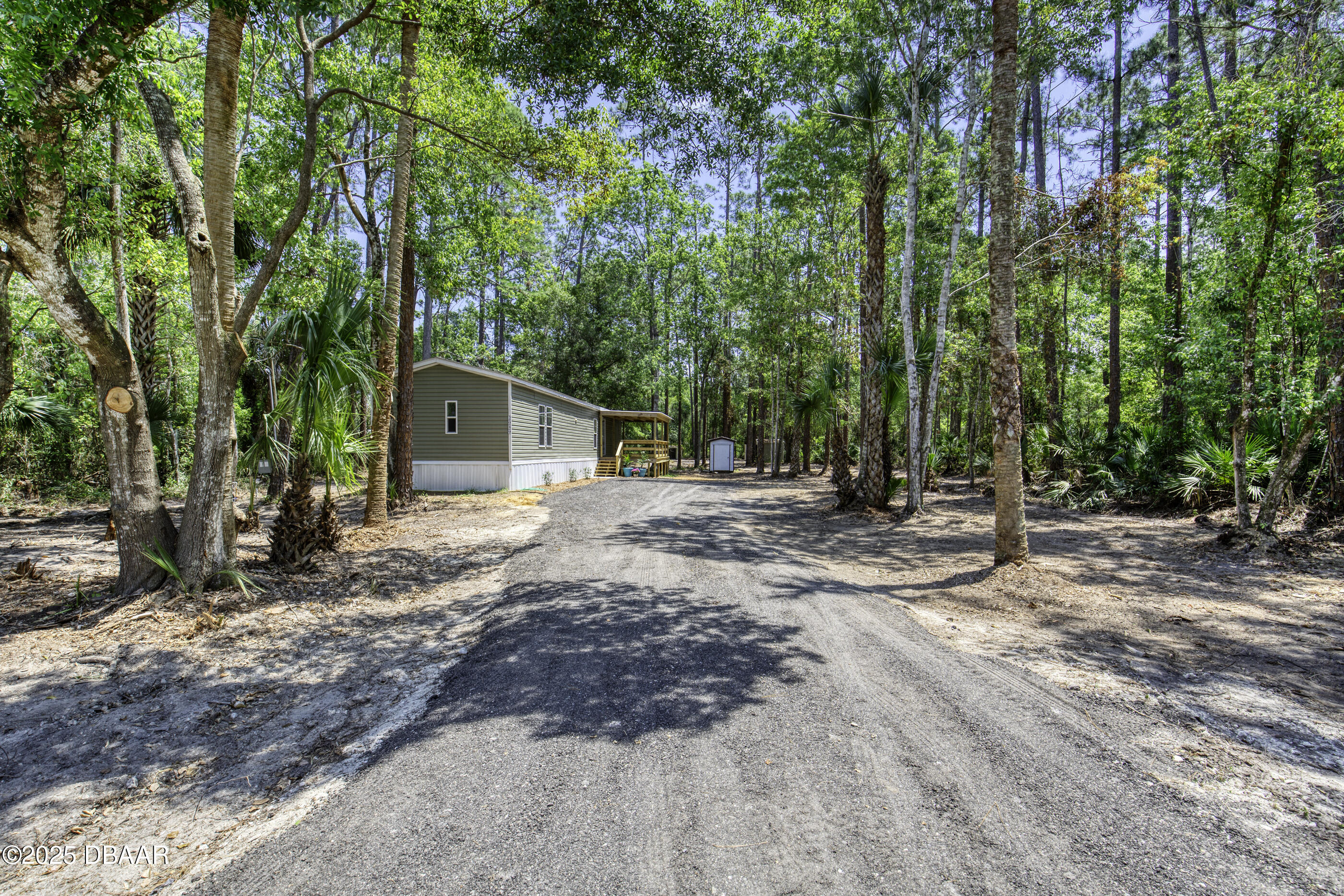 2089 Guava Lane Bunnell, FL 32110 - Photo 2 of 58 a backyard of a house with lots of green space
