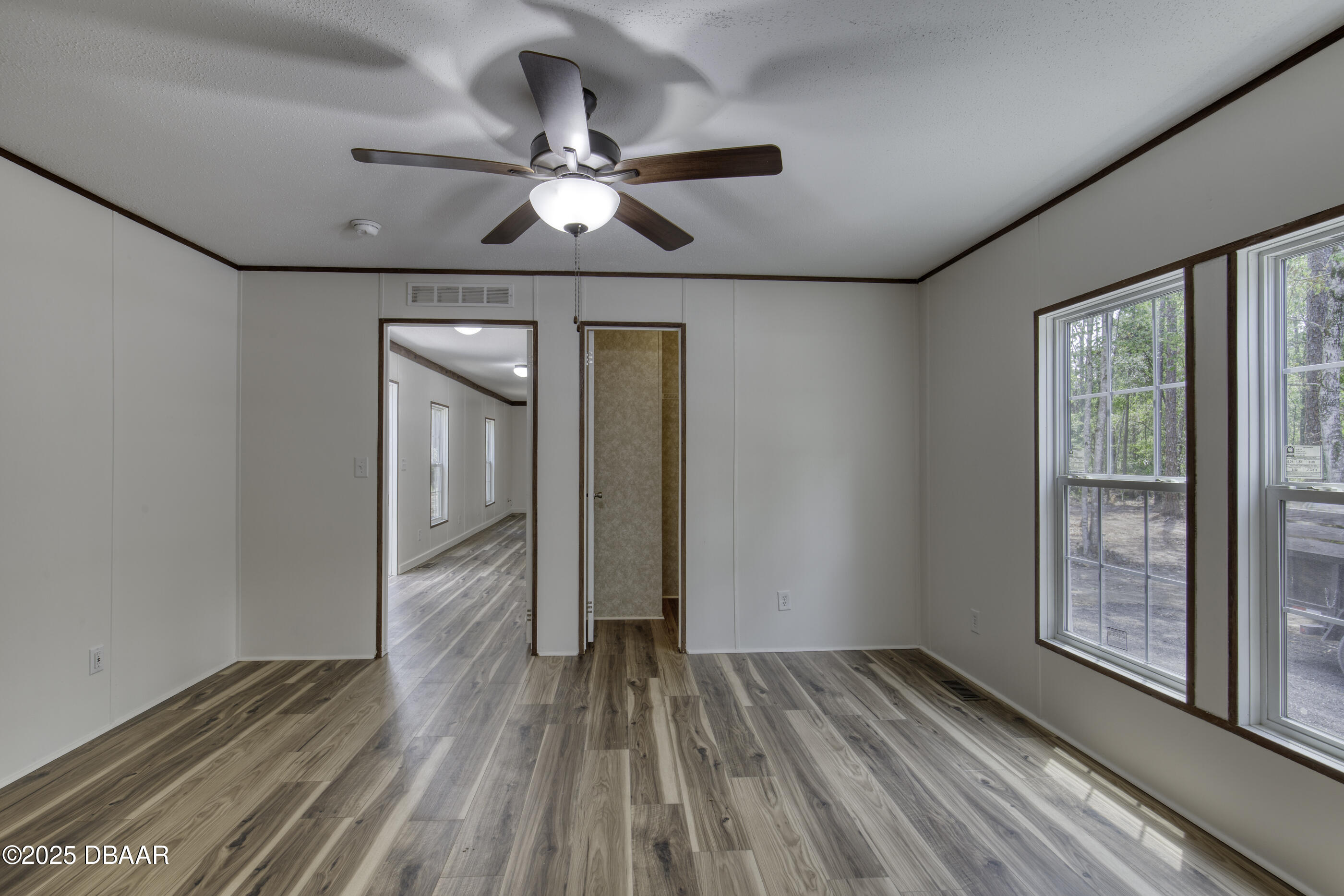2089 Guava Lane Bunnell, FL 32110 - Photo 24 of 58 wooden floor in an empty room with a window