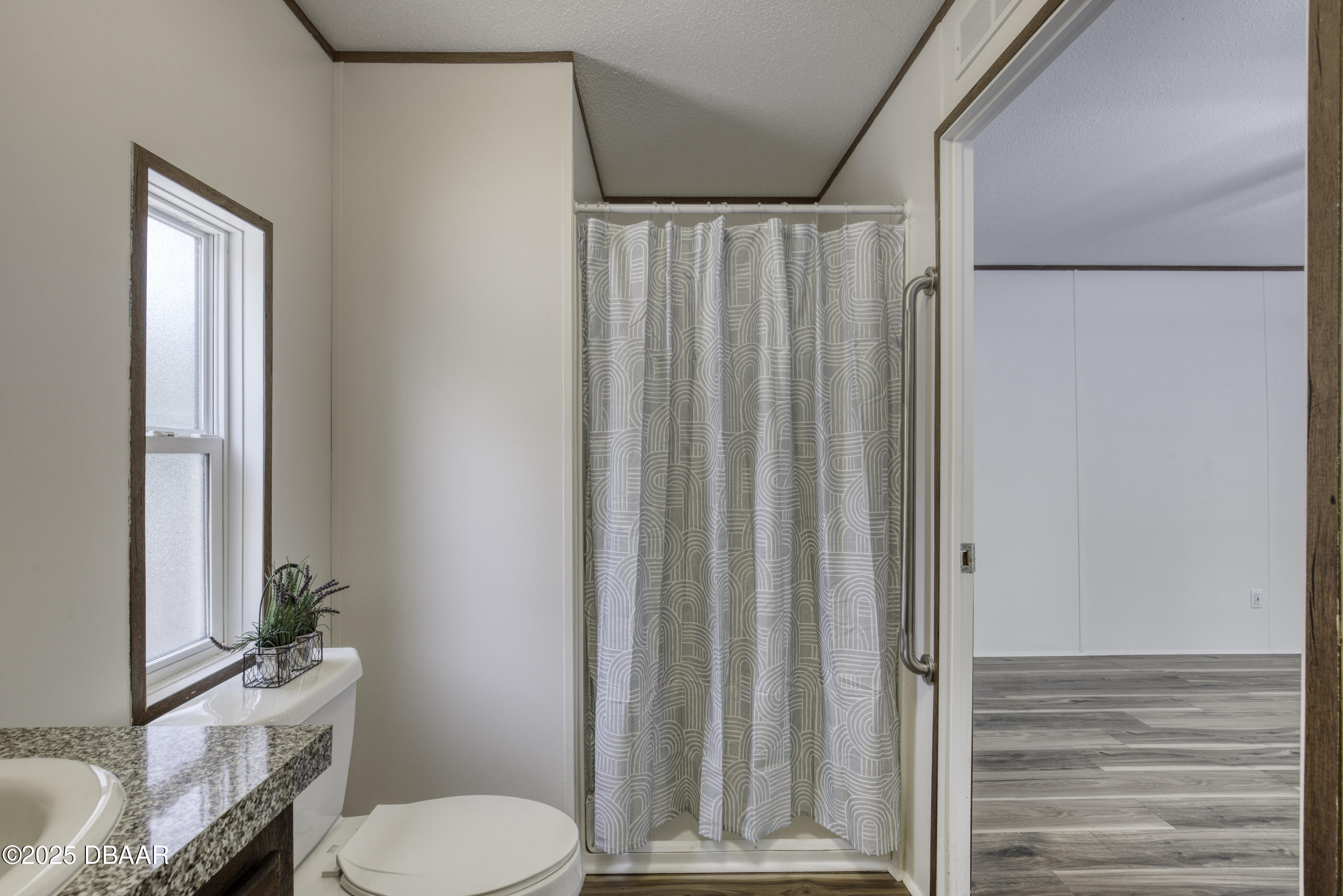 2089 Guava Lane Bunnell, FL 32110 - Photo 29 of 58 a bathroom with a toilet a sink and a shower