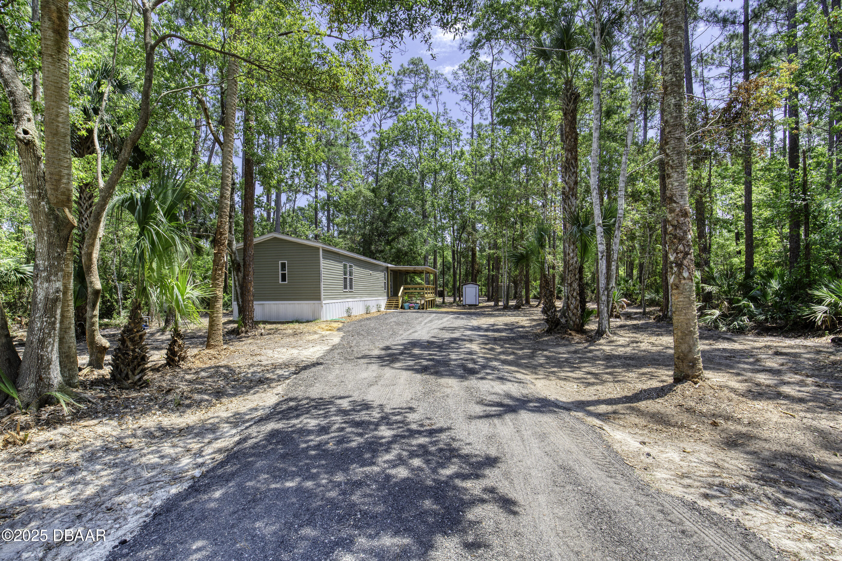 2089 Guava Lane Bunnell, FL 32110 - Photo 3 of 58 a view of a house with backyard and trees