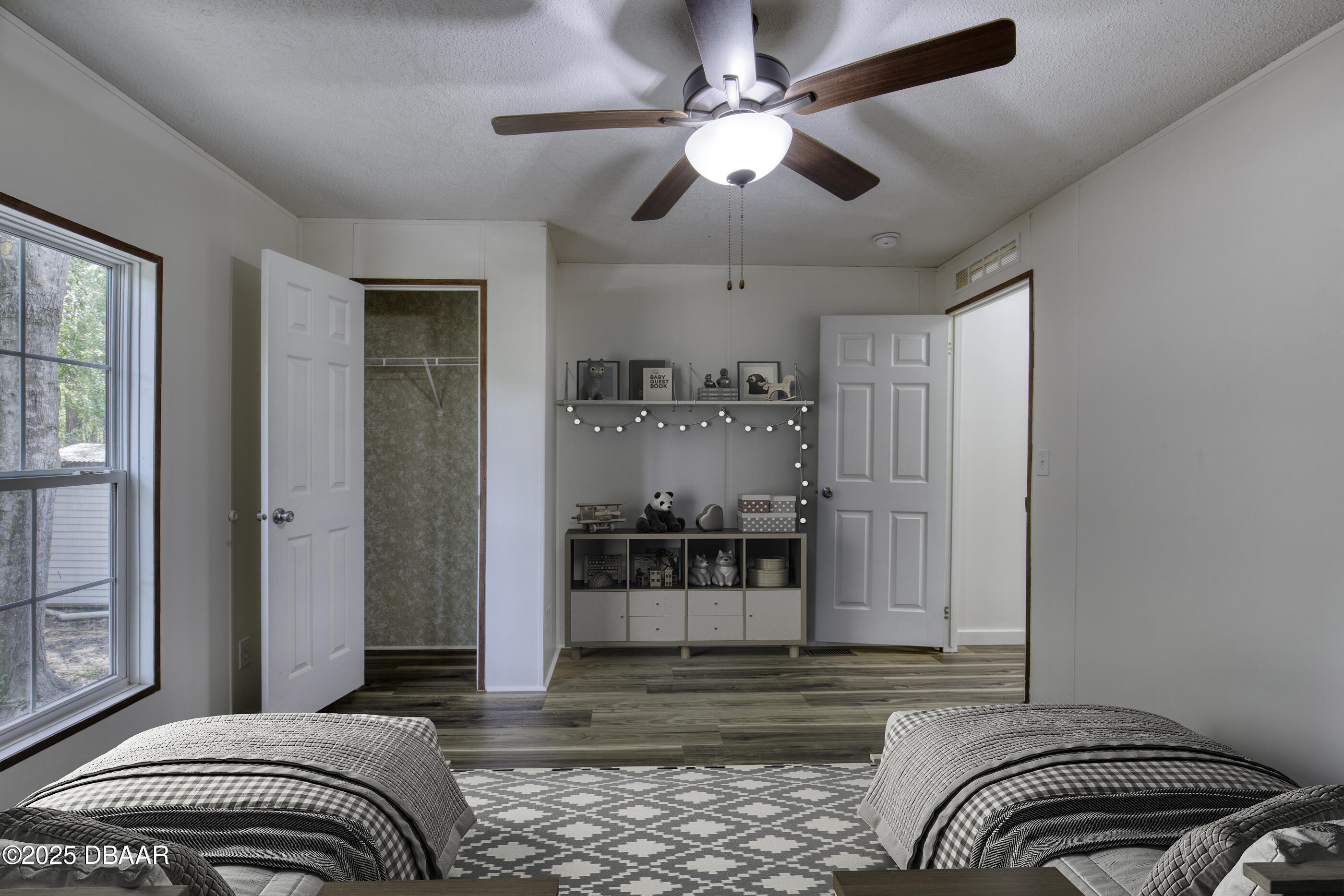 2089 Guava Lane Bunnell, FL 32110 - Photo 33 of 58 a bedroom with a bed and ceiling fan