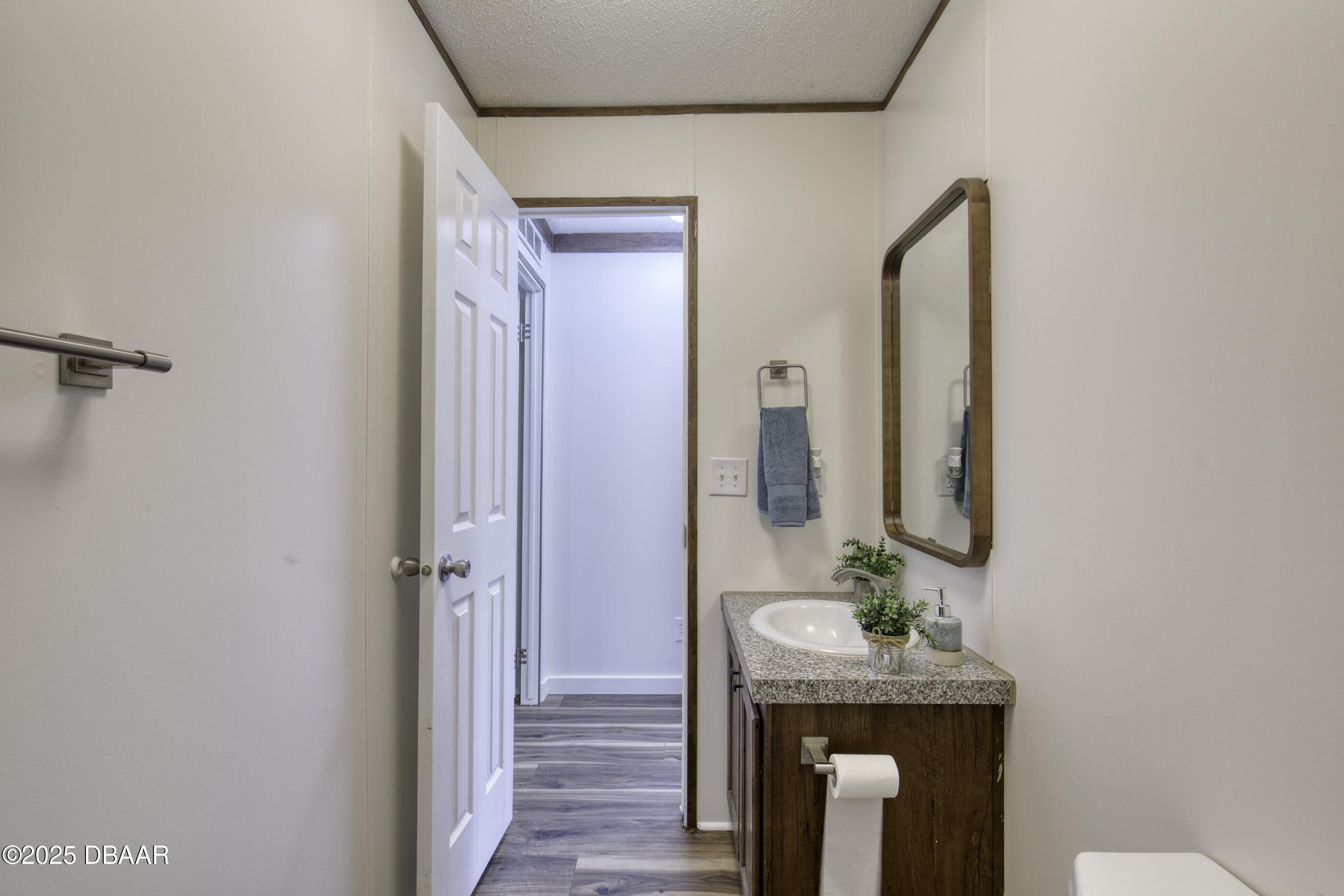 2089 Guava Lane Bunnell, FL 32110 - Photo 36 of 58 a bathroom with a sink a mirror and a shower