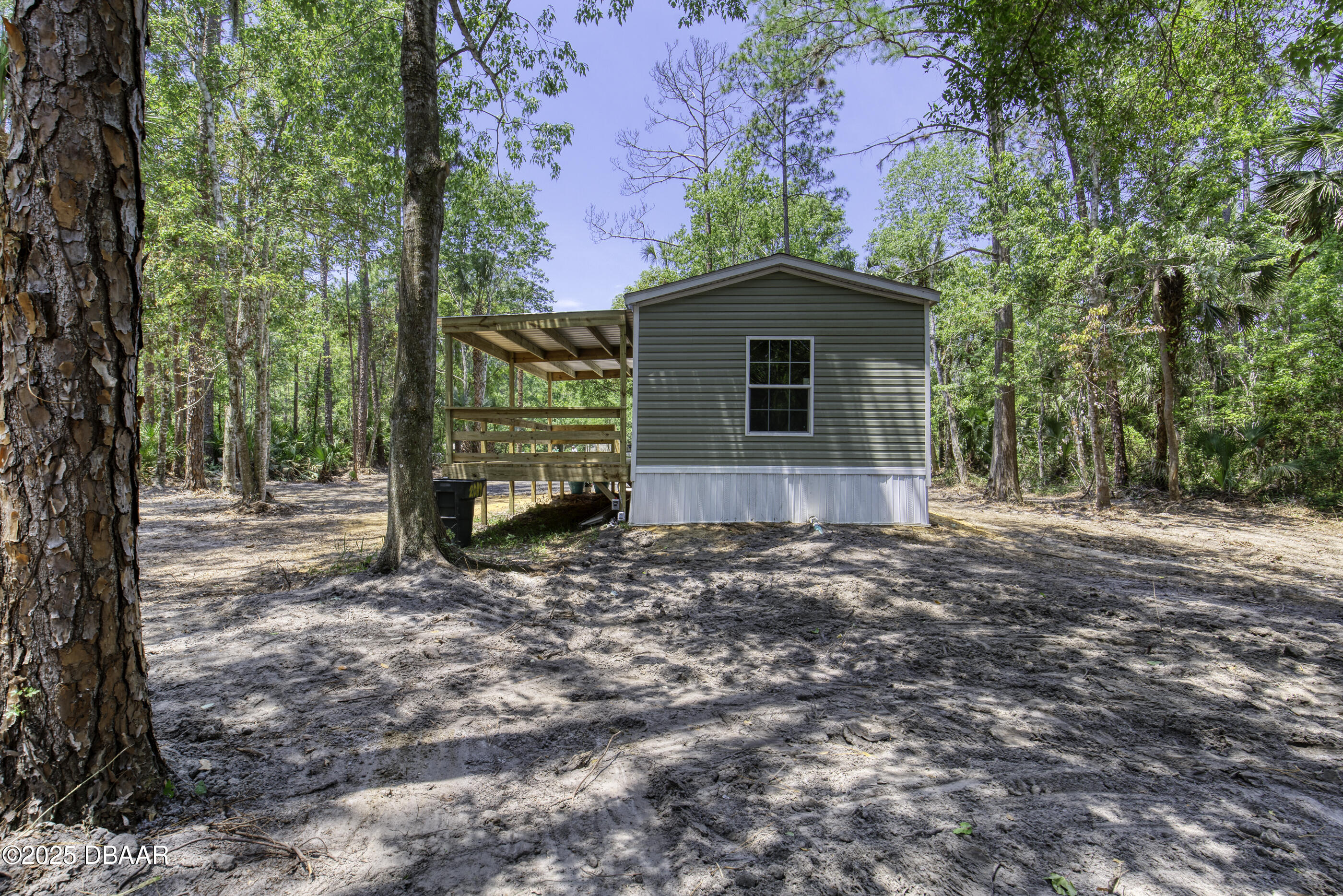 2089 Guava Lane Bunnell, FL 32110 - Photo 44 of 58 a view of a house with a yard