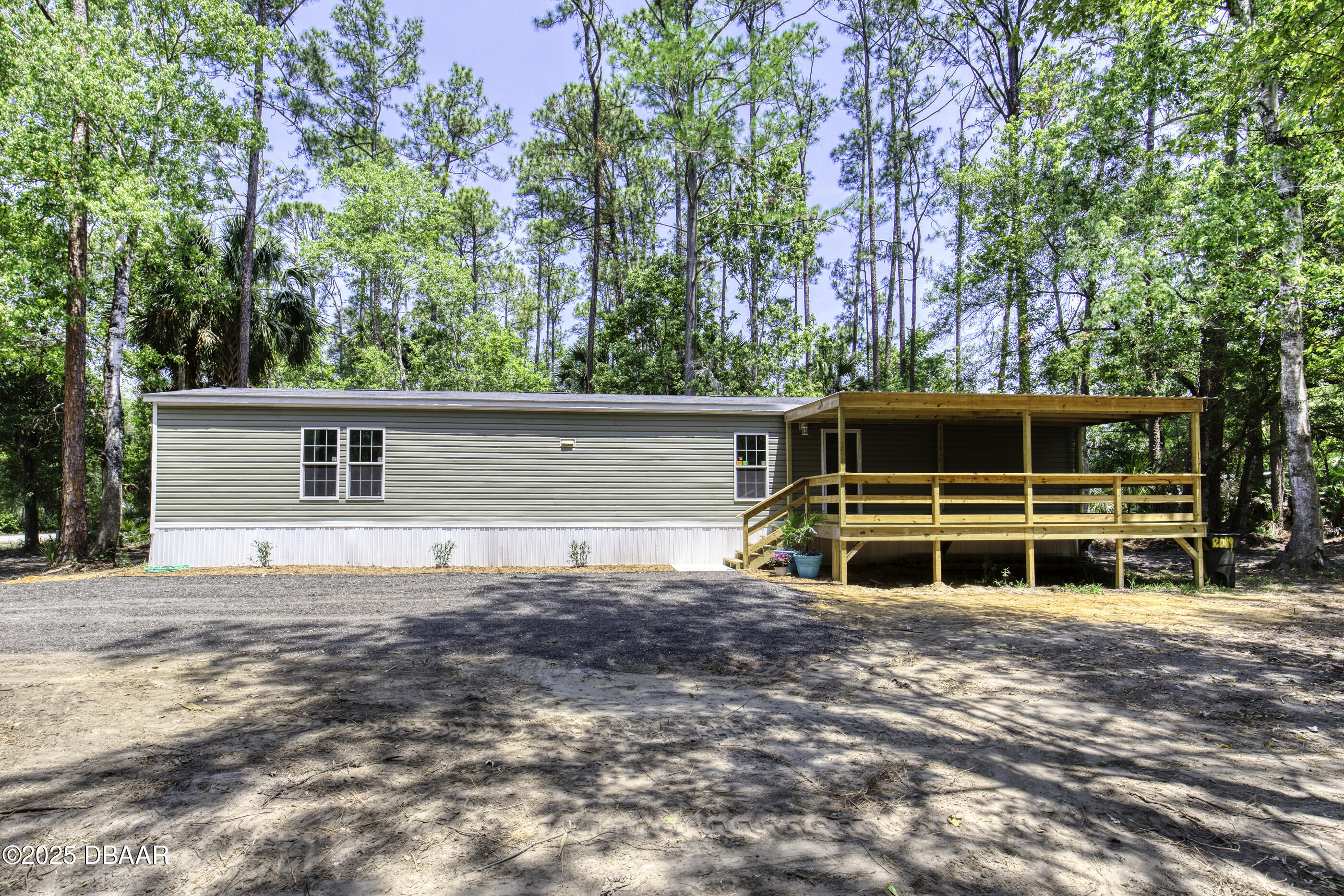 2089 Guava Lane Bunnell, FL 32110 - Photo 7 of 58 a house that has a tree in front of it
