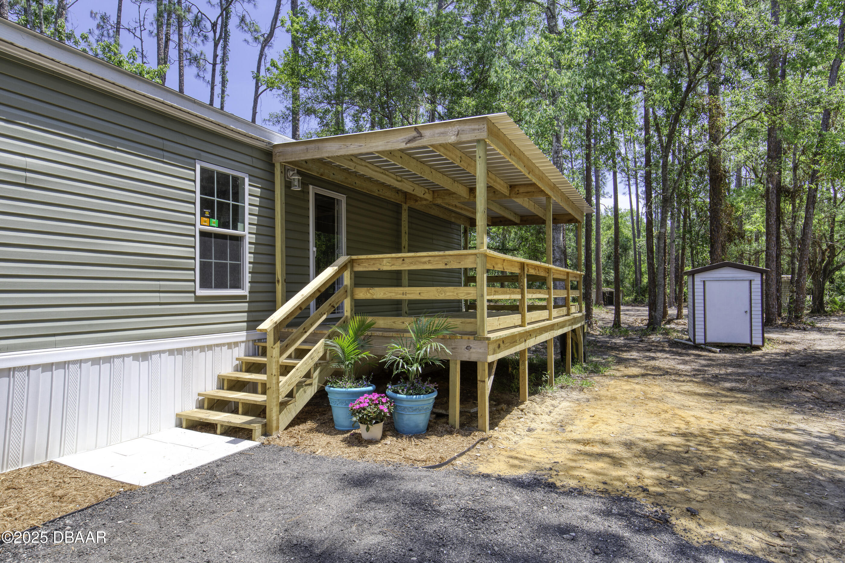 2089 Guava Lane Bunnell, FL 32110 - Photo 8 of 58 a view of a house with backyard and deck
