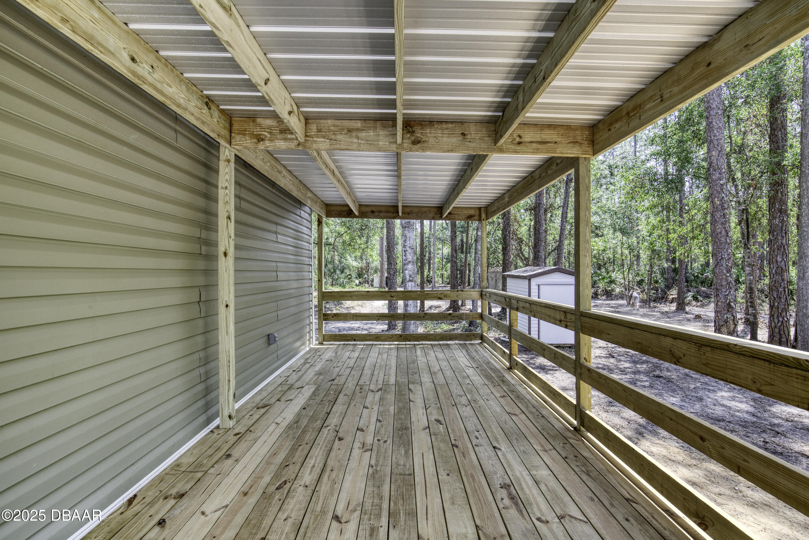2089 Guava Lane Bunnell, FL 32110 - Photo 10 of 58 a view of porch with wooden floor