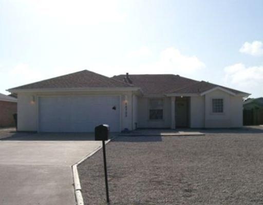 15733 Dyna Street Corpus Christi, TX 78418 - Photo 1 of 1 a front view of a house with a yard