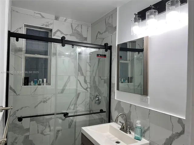 a living room that has a fireplace and a flat screen tv