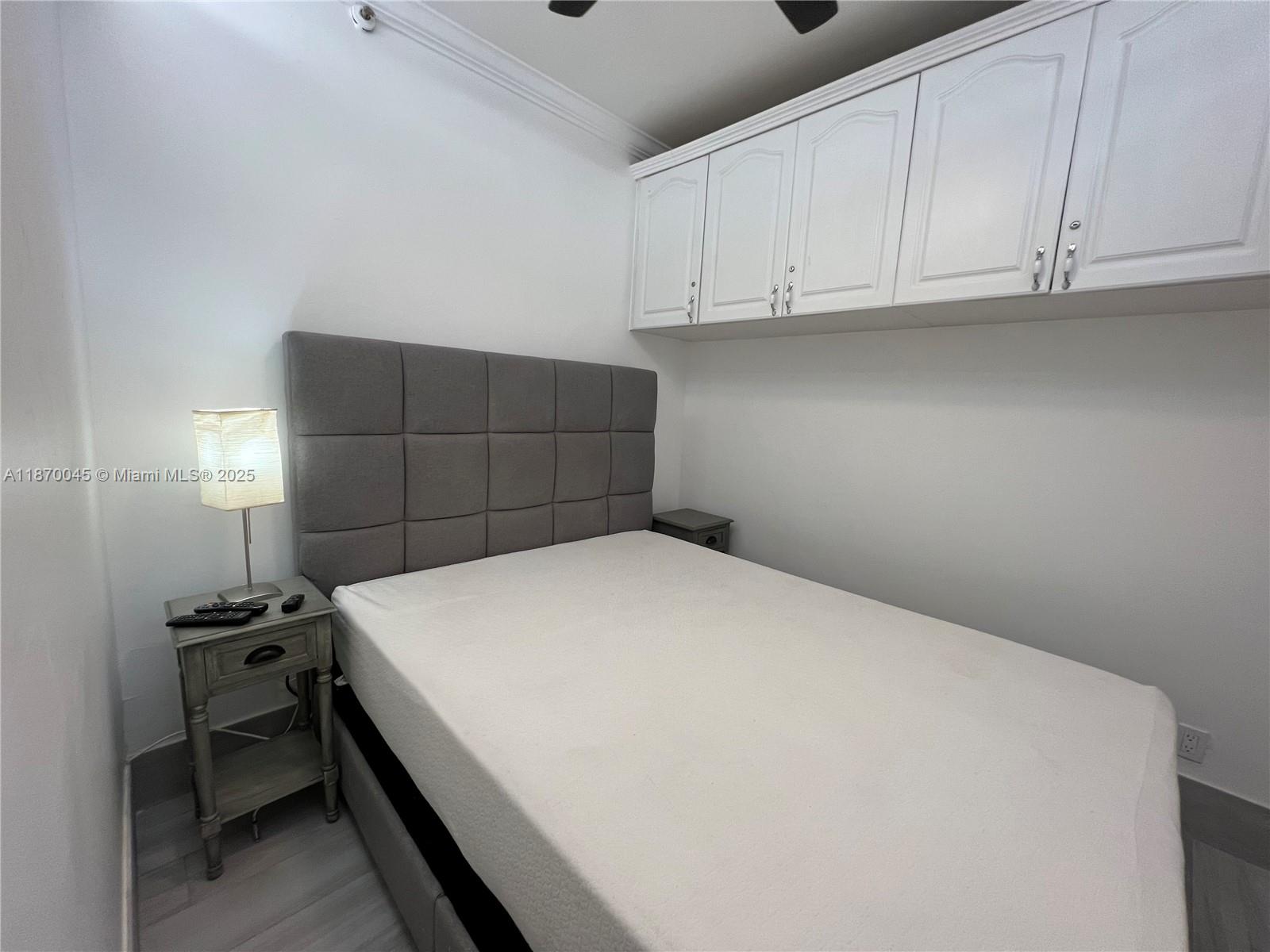 3710 Collins Avenue, Unit N103 Miami Beach, FL 33140 - Photo 16 of 53 a room with a bed and cabinets