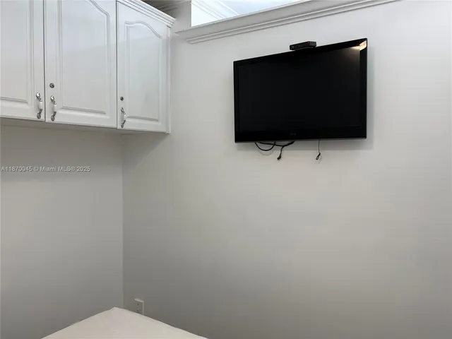 a kitchen with stainless steel appliances a refrigerator microwave and sink