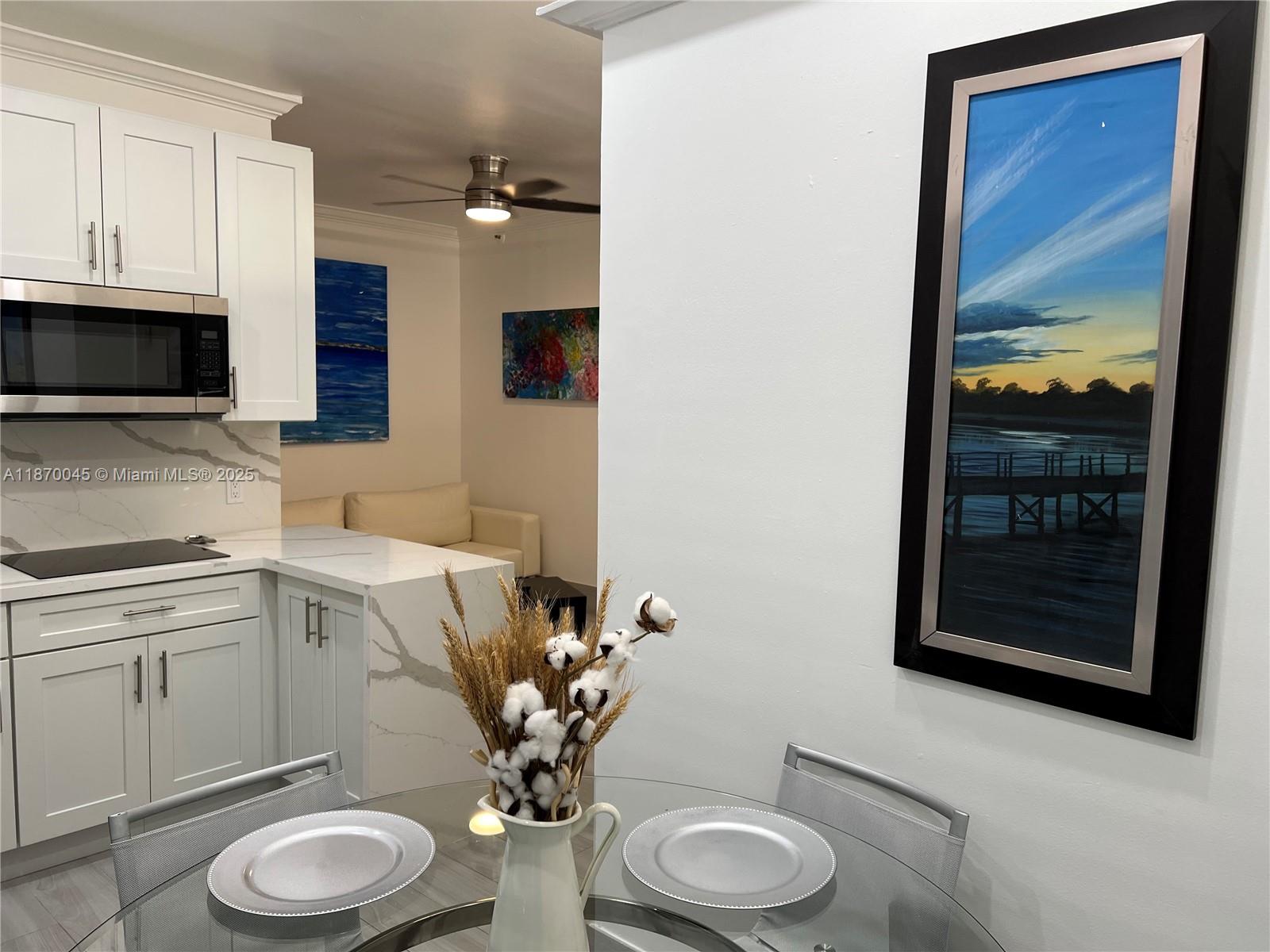 3710 Collins Avenue, Unit N103 Miami Beach, FL 33140 - Photo 25 of 53 a bathroom with a toilet a sink and a mirror