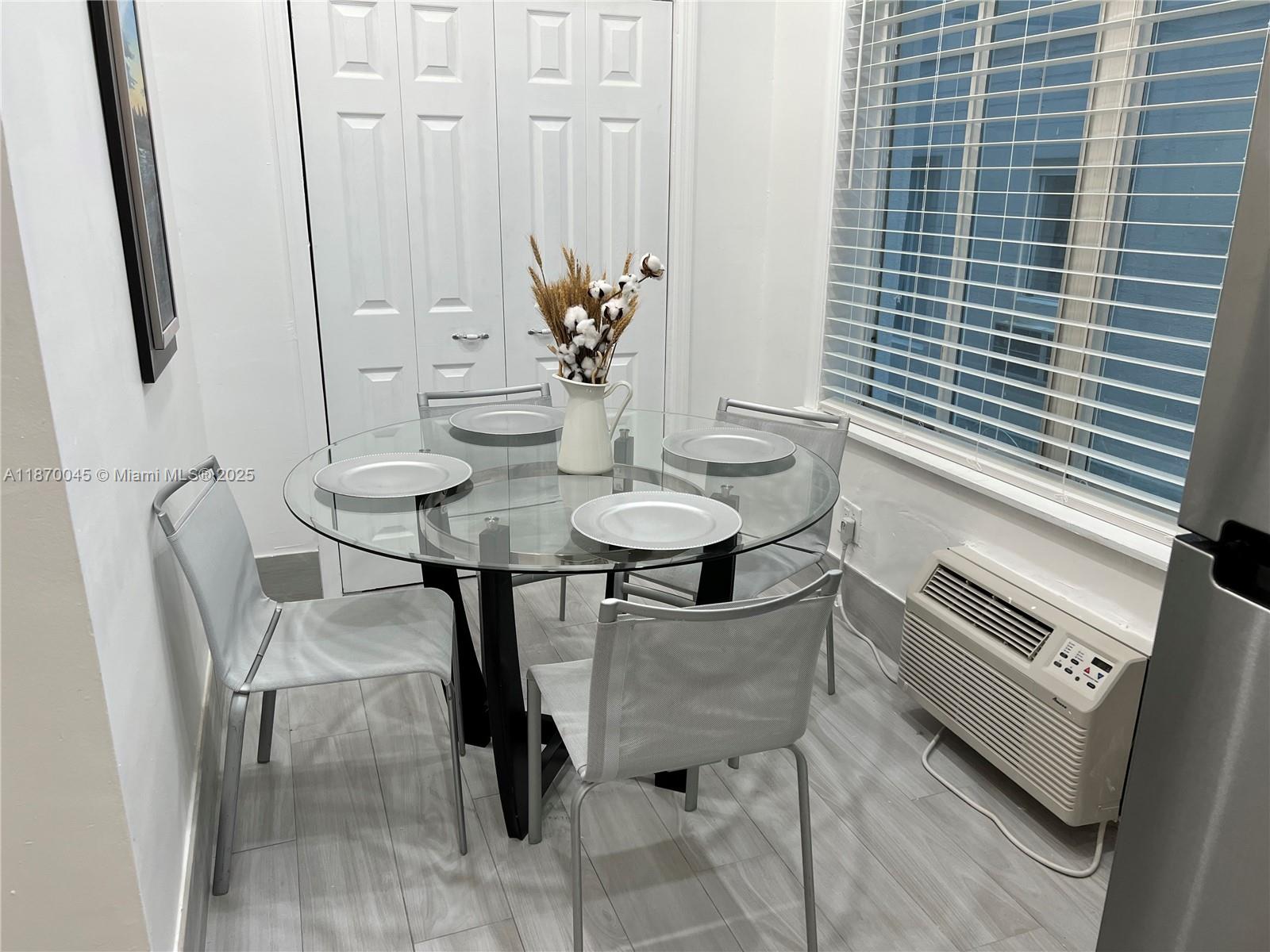 3710 Collins Avenue, Unit N103 Miami Beach, FL 33140 - Photo 4 of 53 a dining room with furniture and window