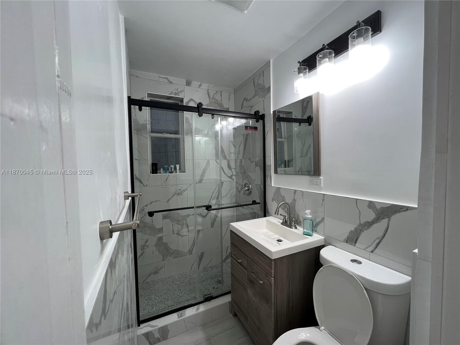 3710 Collins Avenue, Unit N103 Miami Beach, FL 33140 - Photo 6 of 53 a utility room with dryer and washer