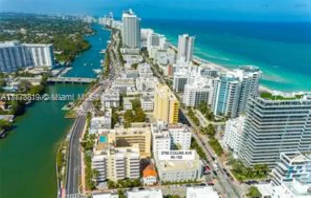 a kitchen with stainless steel appliances granite countertop a refrigerator and a microwave