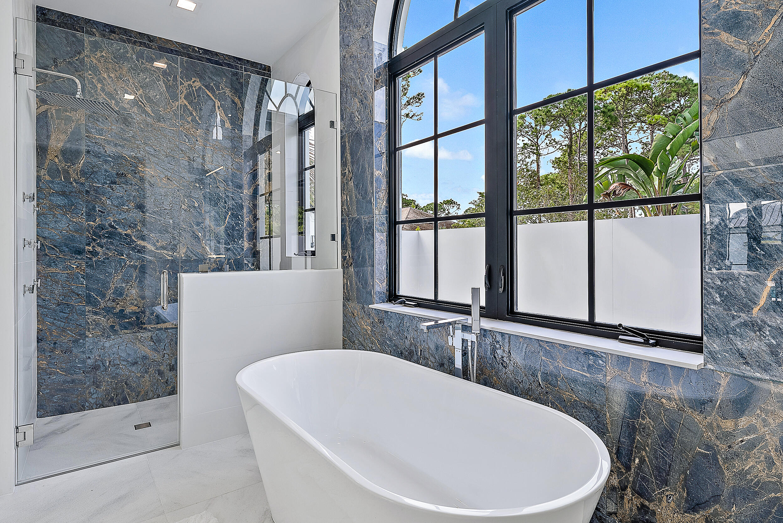 18890 Southeast Jupiter Road Jupiter, FL 33458 - Photo 12 of 33 a bathroom with a bathtub and shower