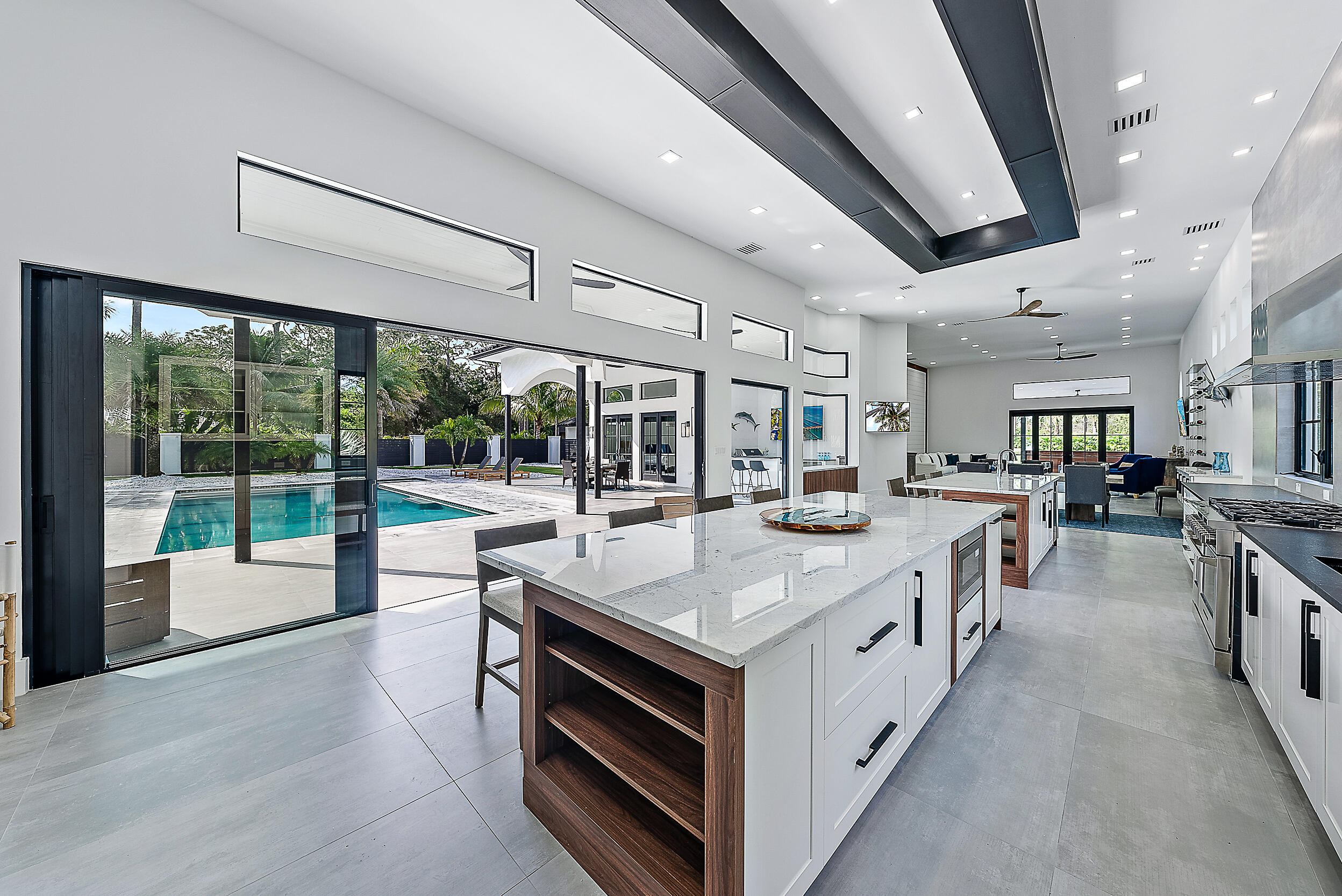 18890 Southeast Jupiter Road Jupiter, FL 33458 - Photo 15 of 33 a large white kitchen with a large window