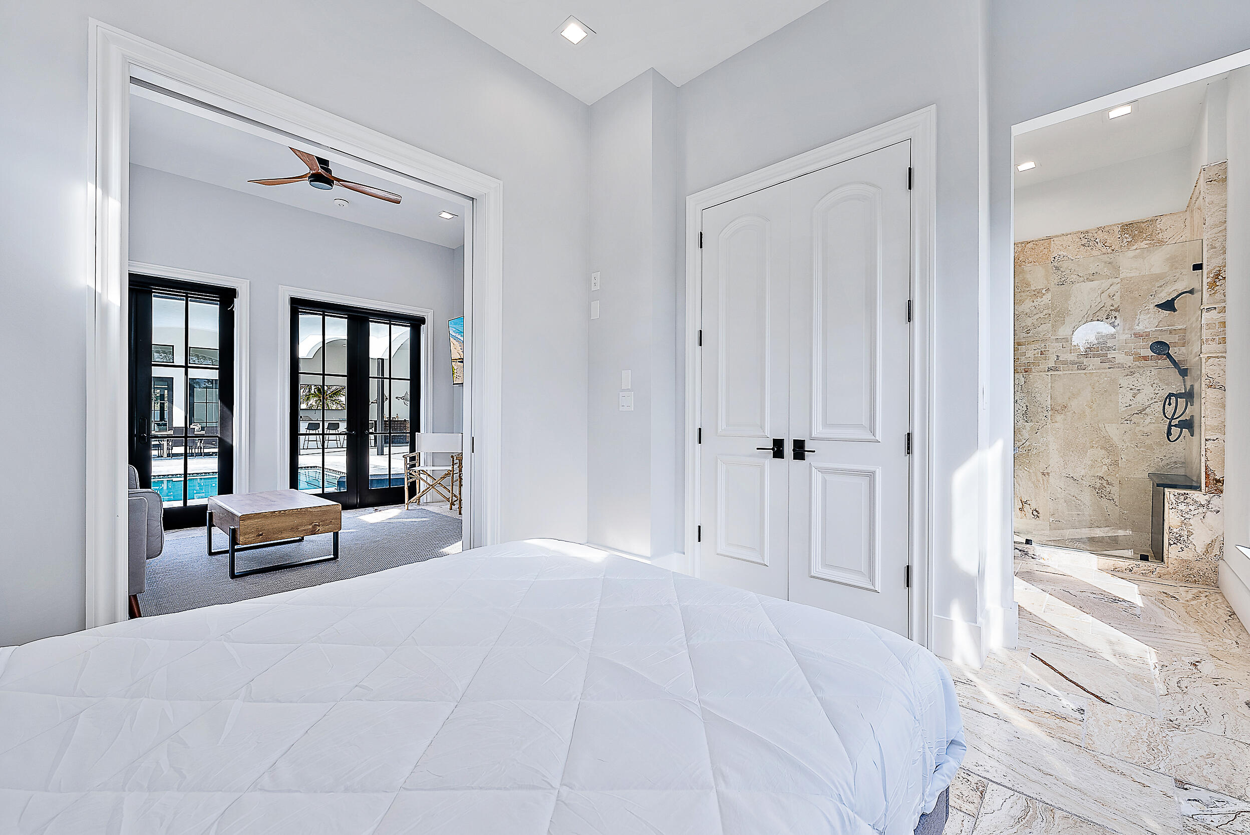 18890 Southeast Jupiter Road Jupiter, FL 33458 - Photo 19 of 33 a bedroom with a large bed and a large mirror