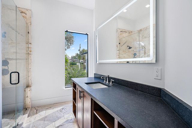 a spacious bedroom with a bed and a window