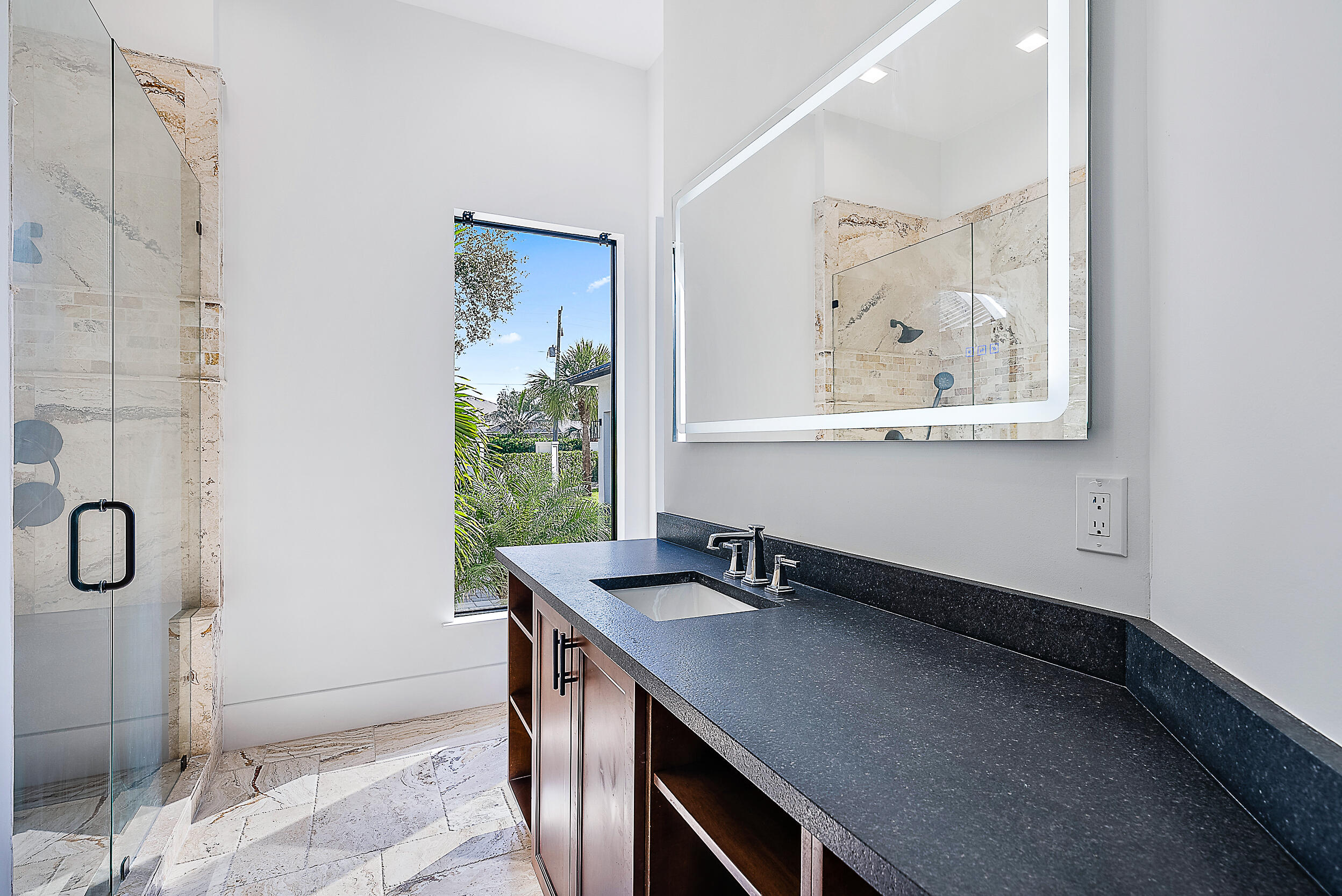 18890 Southeast Jupiter Road Jupiter, FL 33458 - Photo 21 of 33 a view of a bathroom with a sink and a mirror