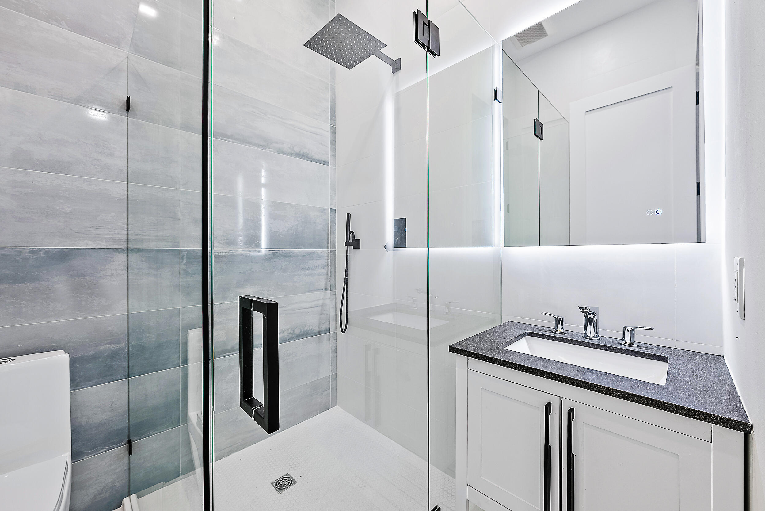 18890 Southeast Jupiter Road Jupiter, FL 33458 - Photo 23 of 33 a bathroom with a sink and a mirror