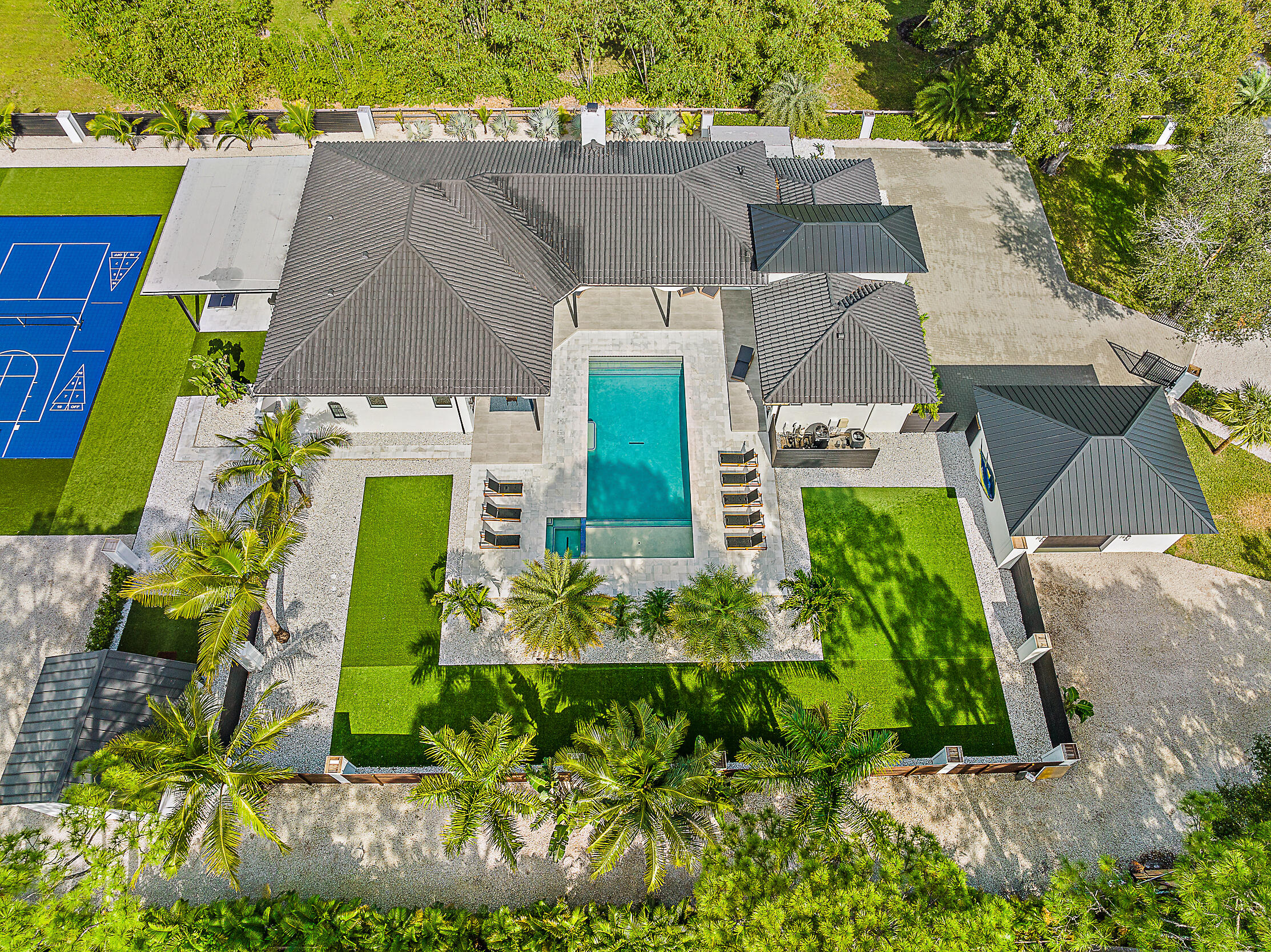 18890 Southeast Jupiter Road Jupiter, FL 33458 - Photo 25 of 33 an aerial view of a house with a garden and plants