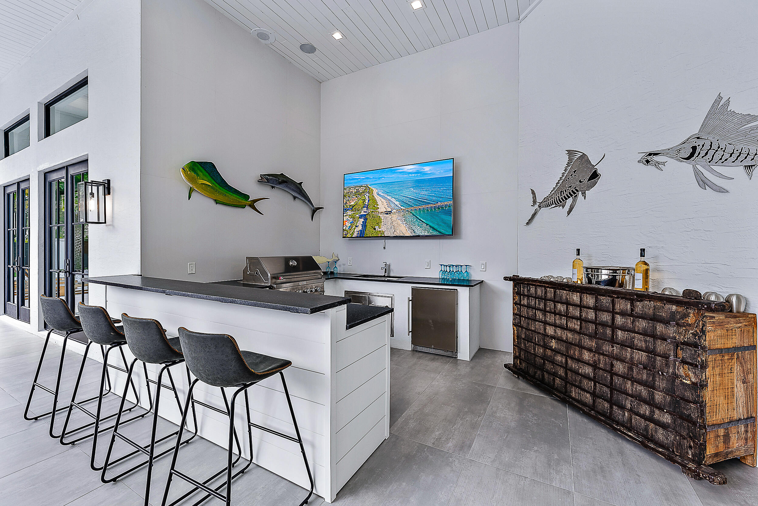 18890 Southeast Jupiter Road Jupiter, FL 33458 - Photo 26 of 33 a kitchen with stainless steel appliances kitchen island granite countertop a sink and cabinets