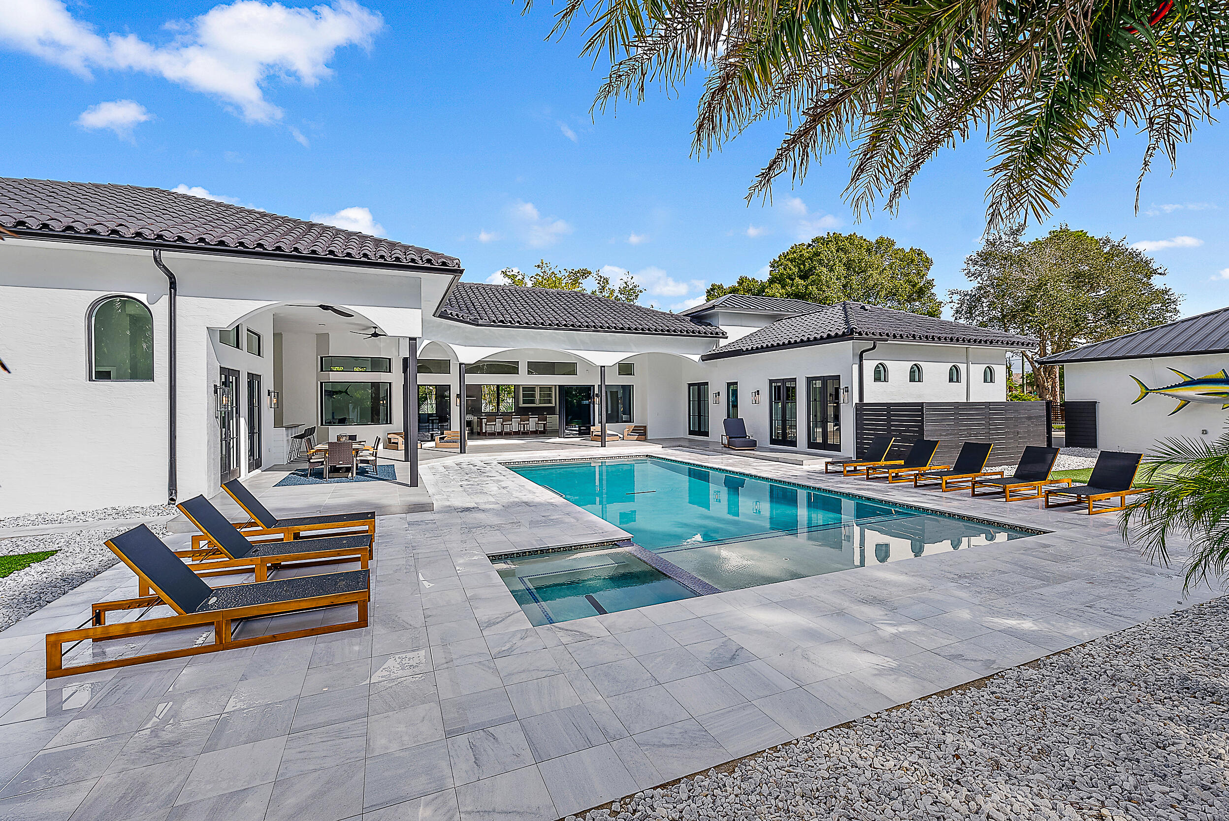 18890 Southeast Jupiter Road Jupiter, FL 33458 - Photo 28 of 33 a view of a house with swimming pool and sitting area