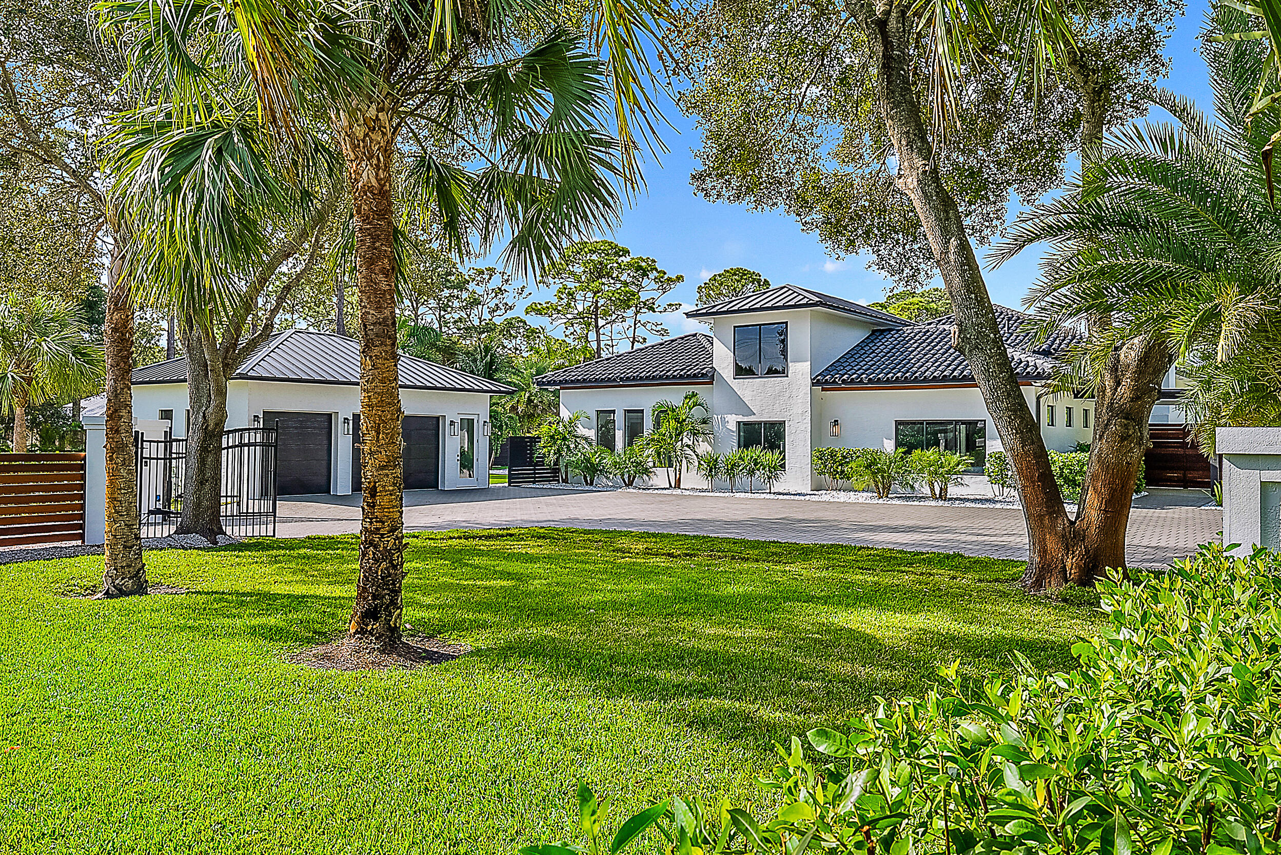 18890 Southeast Jupiter Road Jupiter, FL 33458 - Photo 3 of 33 a view of a house with a yard and a tree