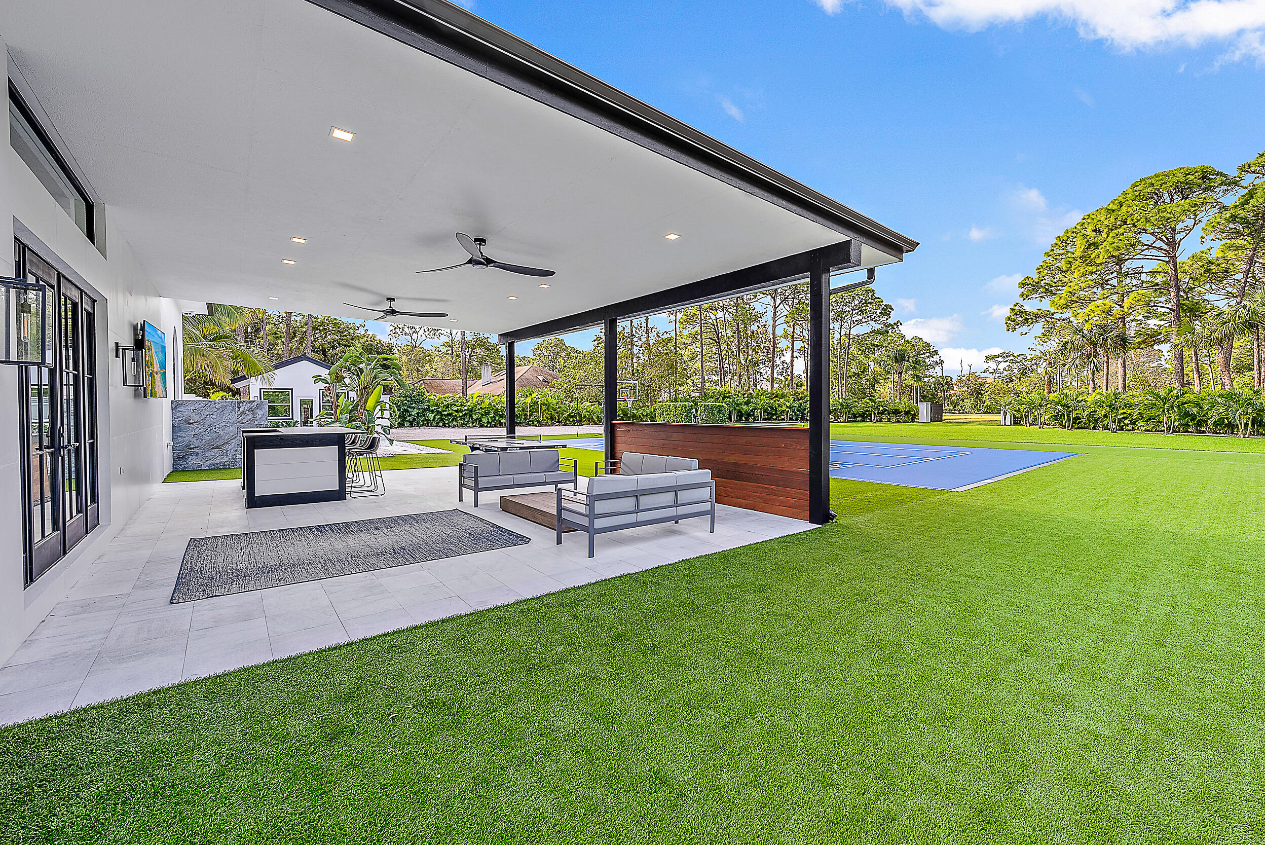 18890 Southeast Jupiter Road Jupiter, FL 33458 - Photo 7 of 33 a view of a patio with a garden