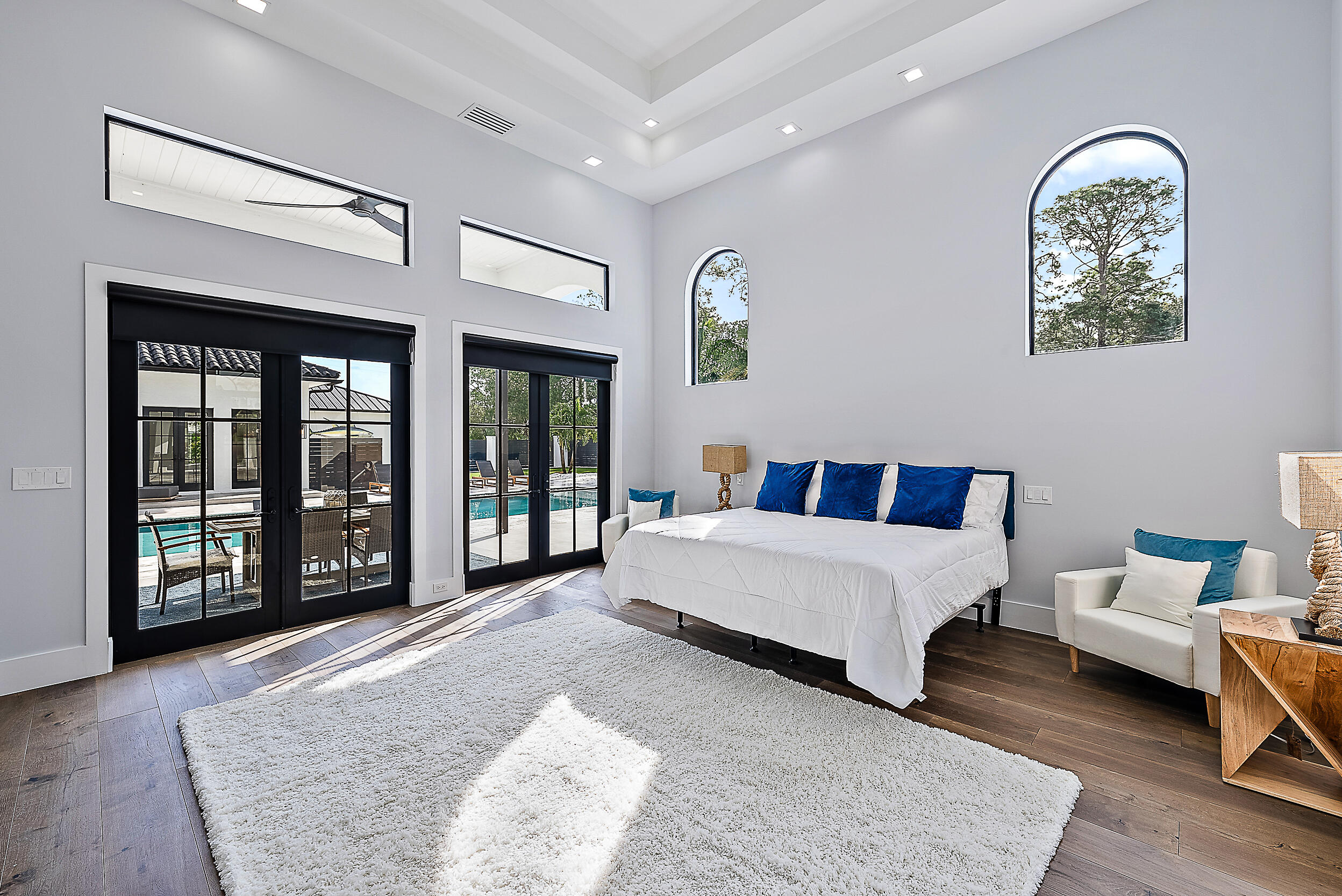 18890 Southeast Jupiter Road Jupiter, FL 33458 - Photo 9 of 33 a spacious bedroom with a large bed and a window