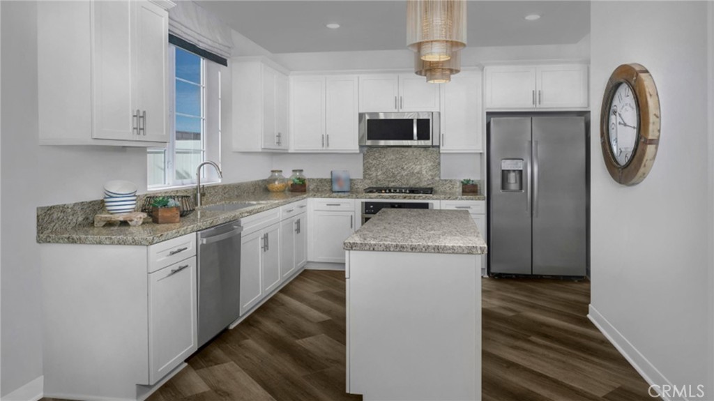 2016 Dewdrop Upland, CA 91786 - Photo 4 of 16 a kitchen with granite countertop stainless steel appliances a sink and a refrigerator